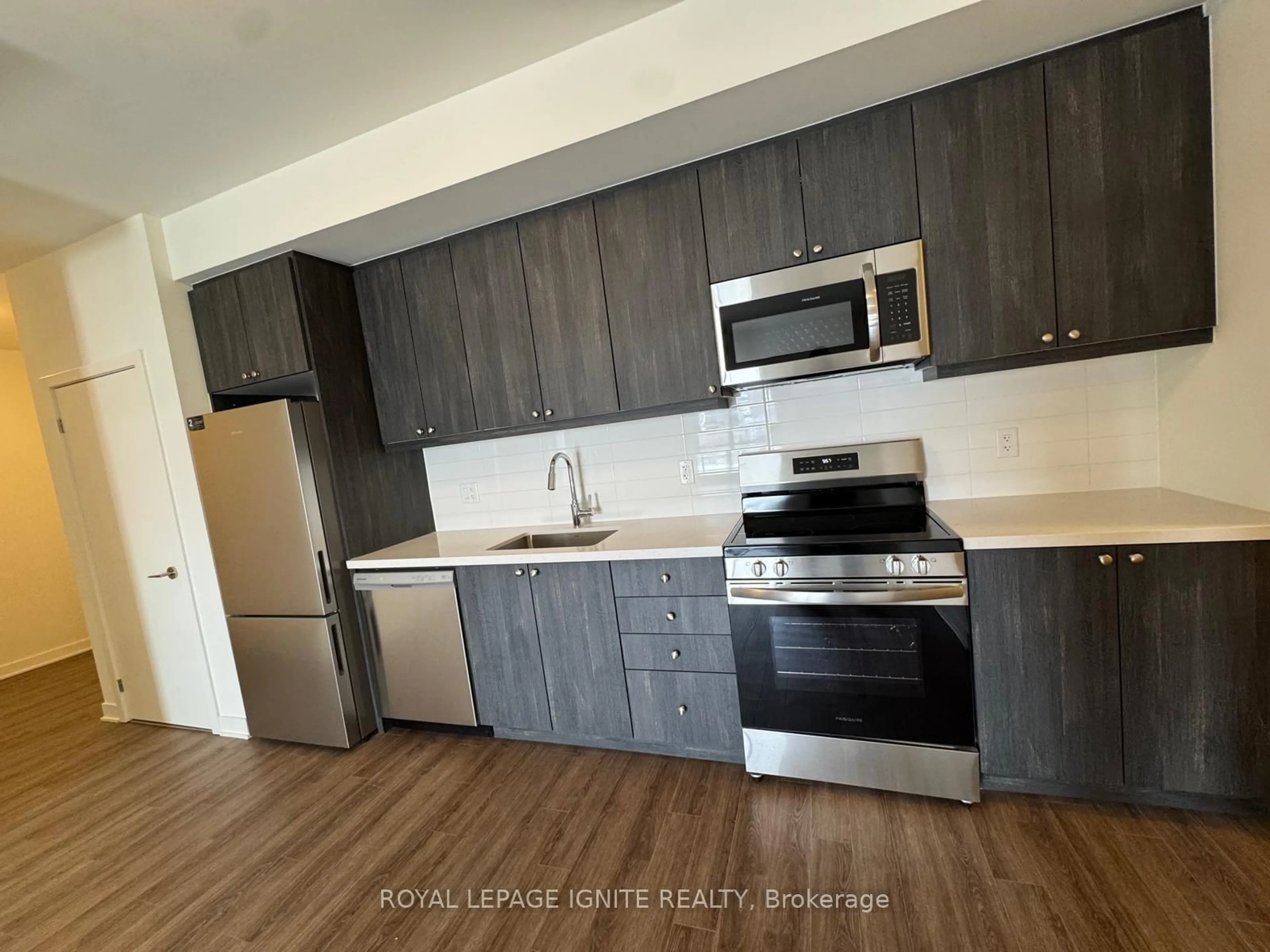 Standard kitchen, wood/laminate floor for 51 Clarington Blvd #101, Clarington Ontario L1C 7J8