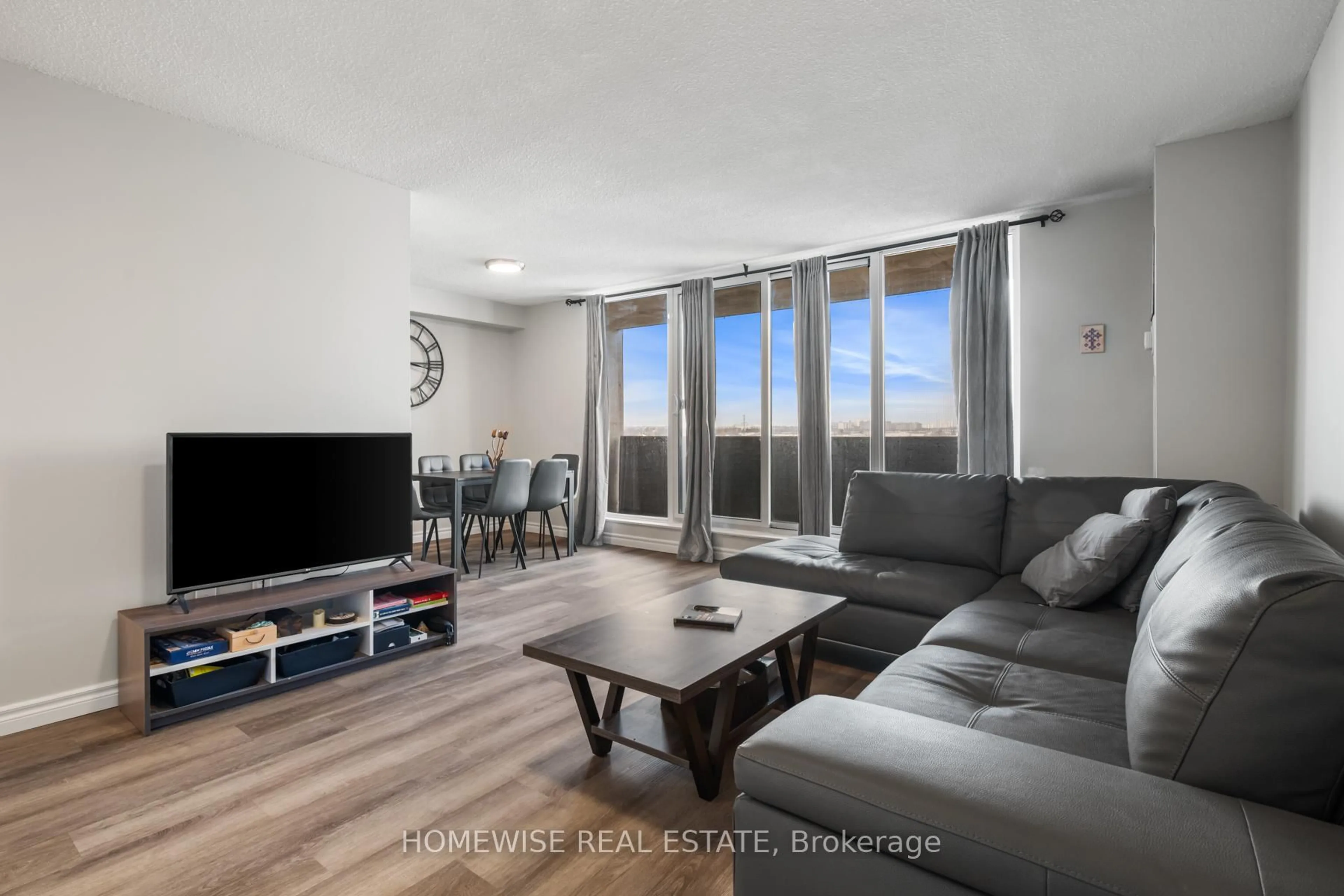 Living room with furniture, wood/laminate floor for 100 Prudential Dr #909, Toronto Ontario M1P 4V4