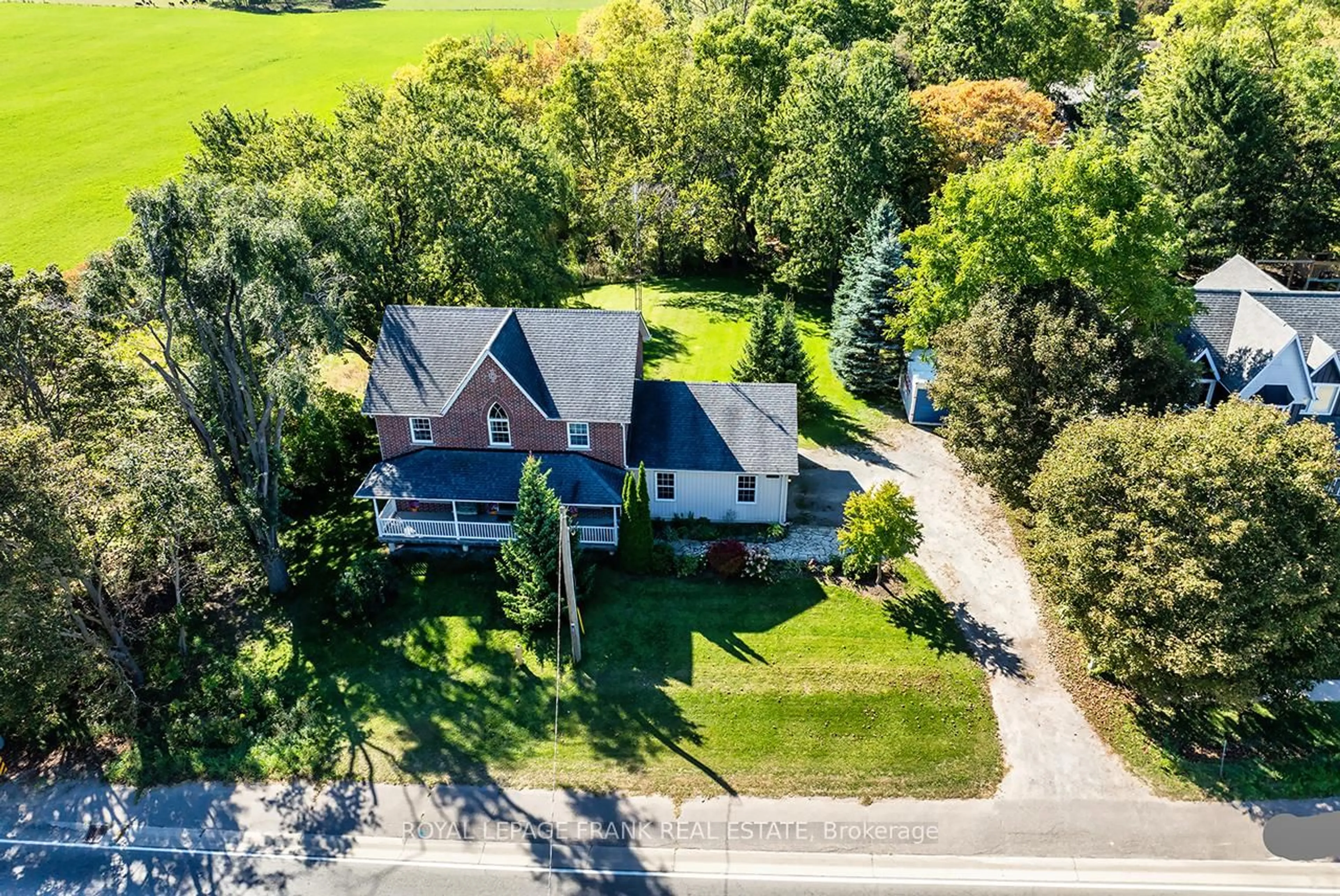 A pic from outside/outdoor area/front of a property/back of a property/a pic from drone, street for 19826 Highway 12 Highway, Scugog Ontario L0C 1B0