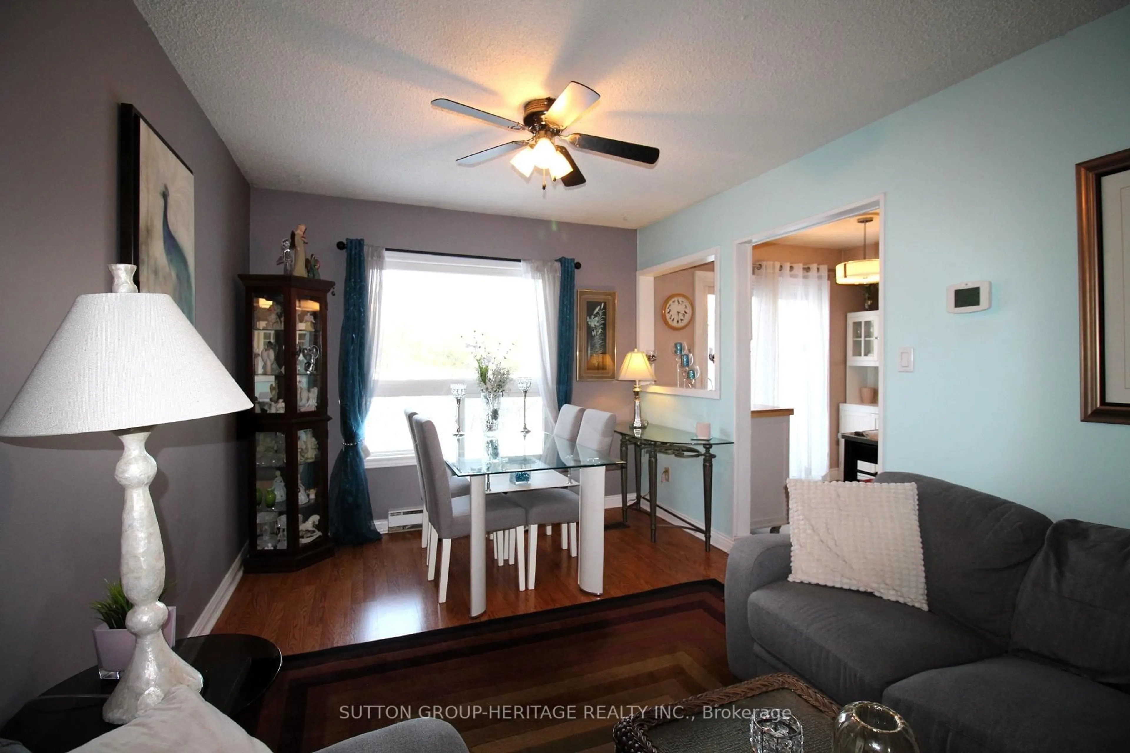 Living room with furniture, wood/laminate floor for 56 Parker Cres, Ajax Ontario L1S 3R5