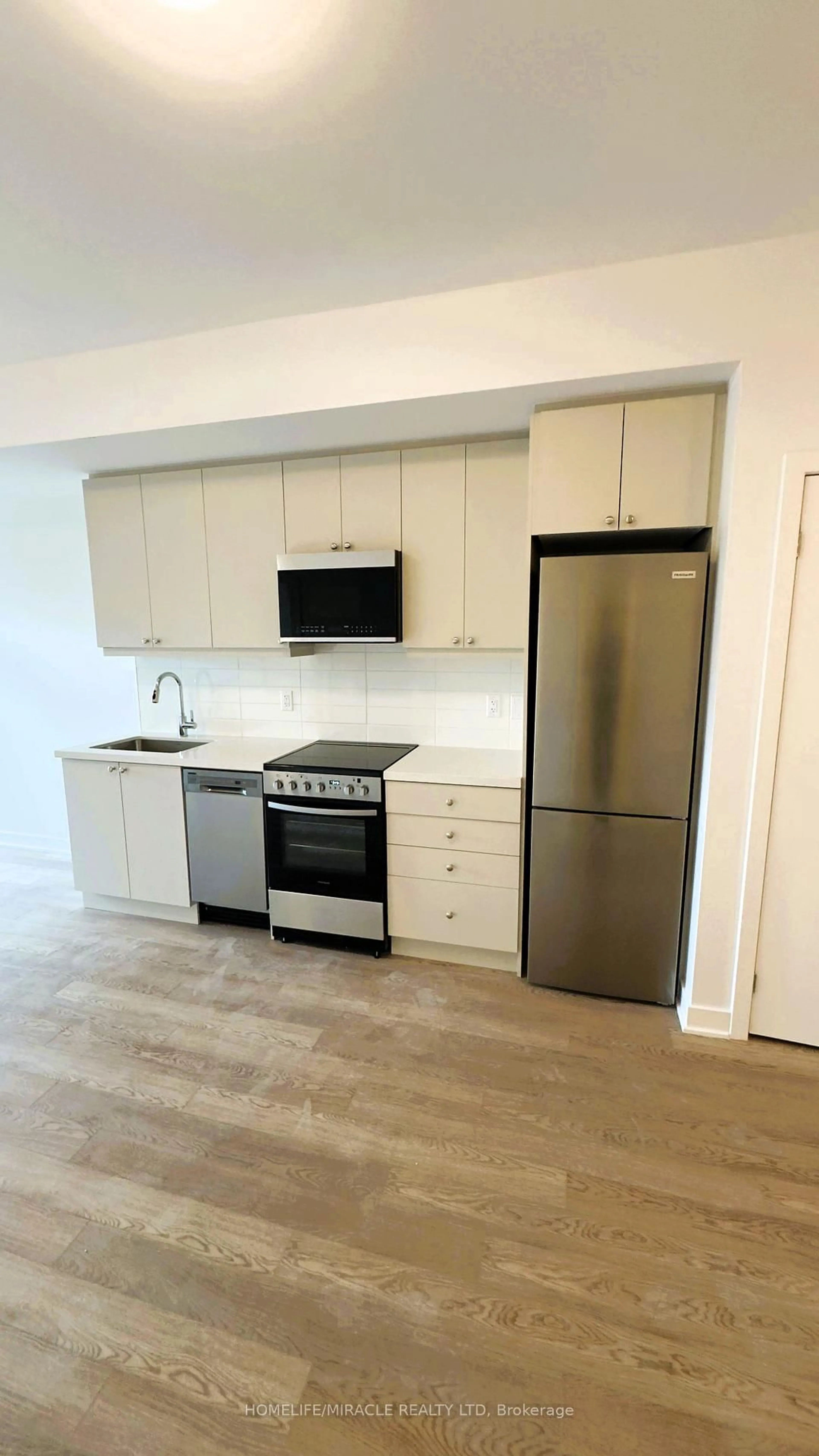 Standard kitchen, wood/laminate floor for 55 Clarington Blvd #404, Clarington Ontario L1C 7J4