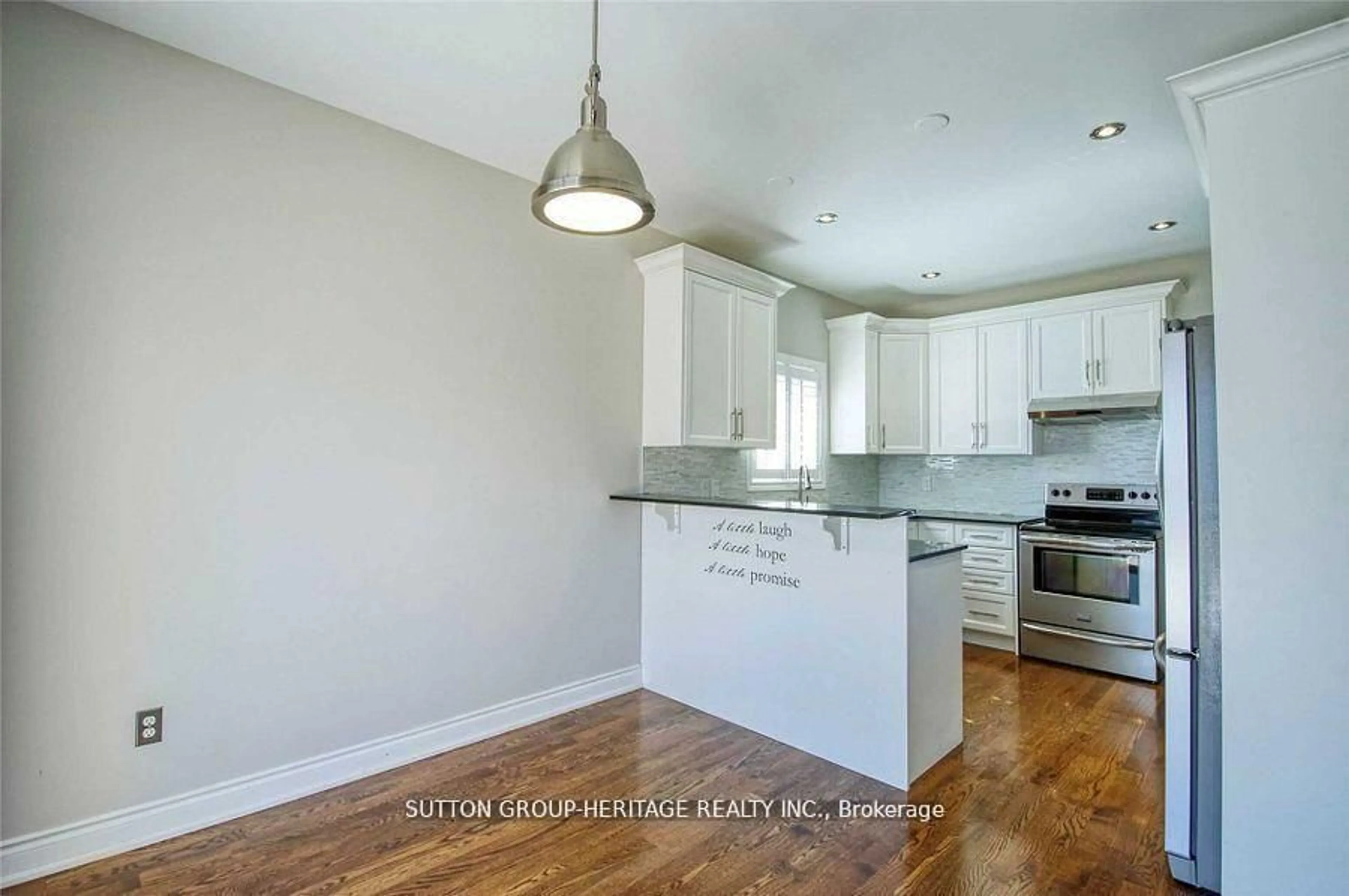 Open concept kitchen, wood/laminate floor for 52 Wessex Dr, Whitby Ontario L1M 2C3