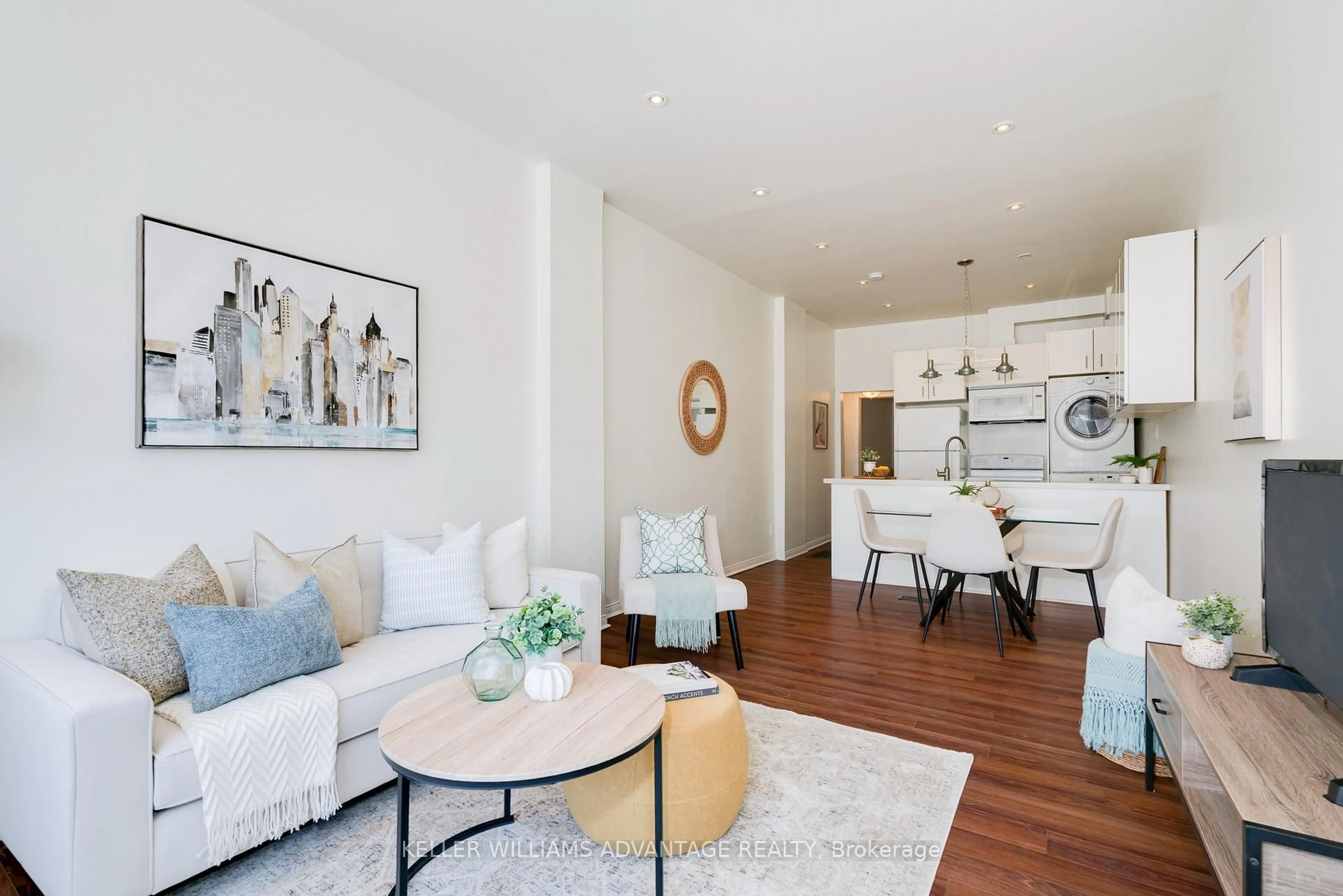 Living room with furniture, wood/laminate floor for 493 Jones Ave, Toronto Ontario M4J 3G8