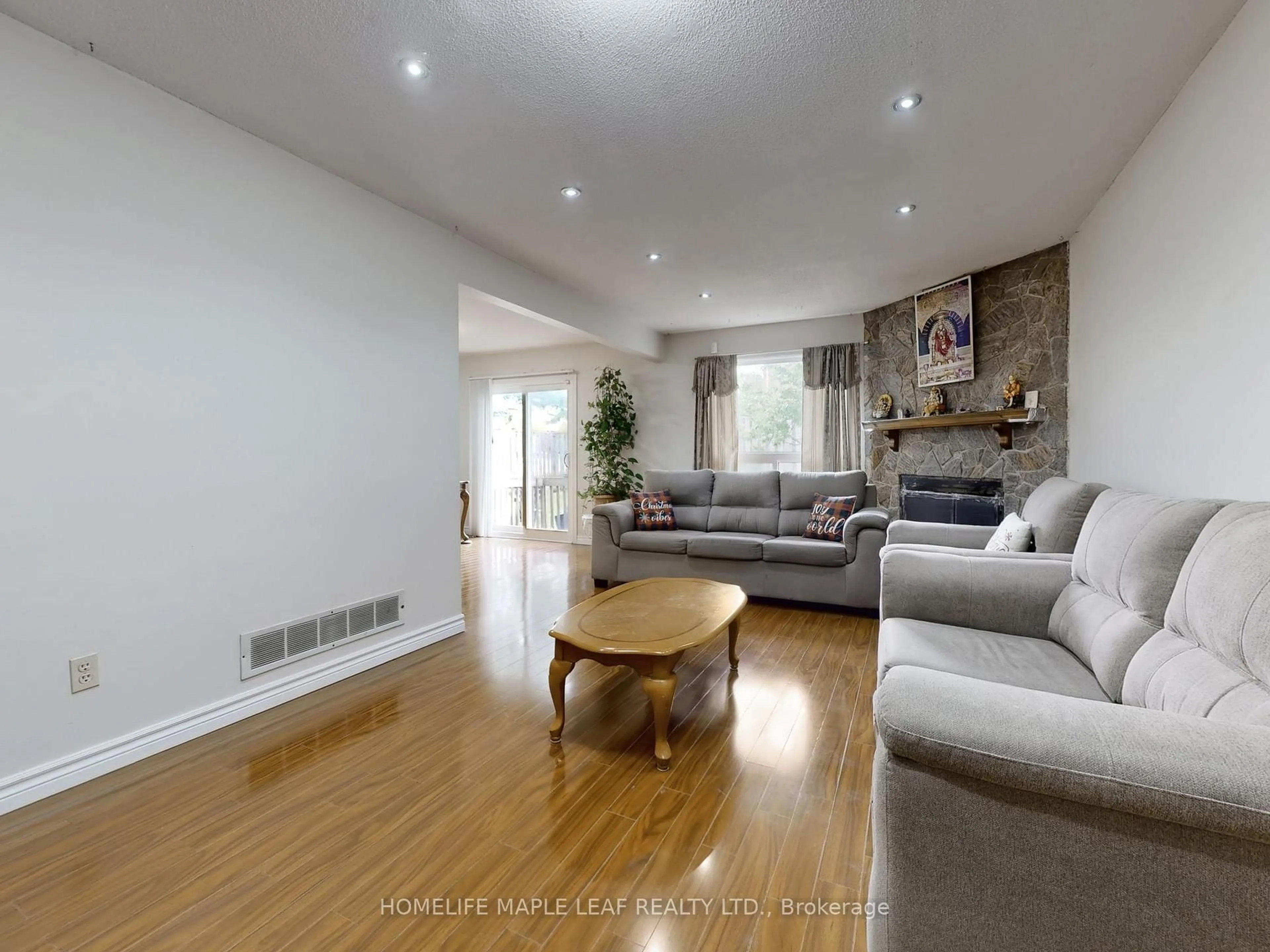 Living room with furniture, wood/laminate floor for 39 Lamay Cres, Toronto Ontario M1X 1J2