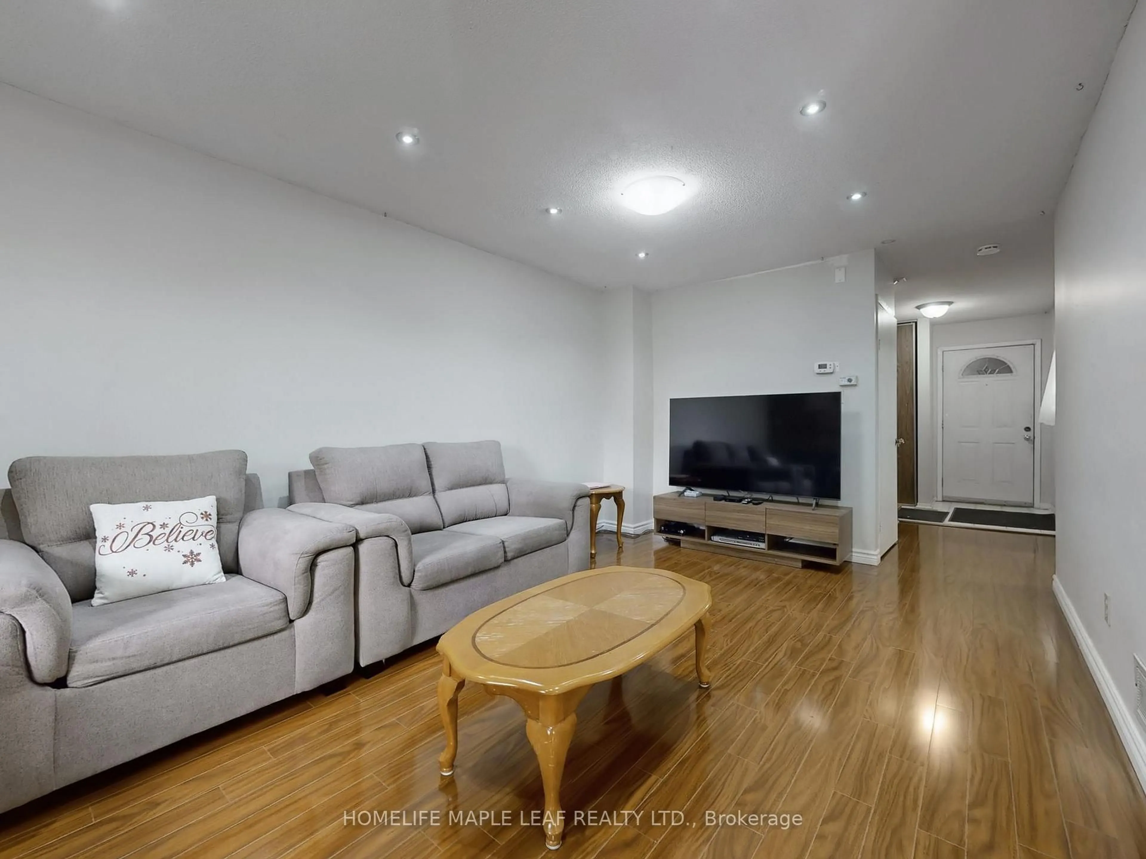Living room with furniture, wood/laminate floor for 39 Lamay Cres, Toronto Ontario M1X 1J2