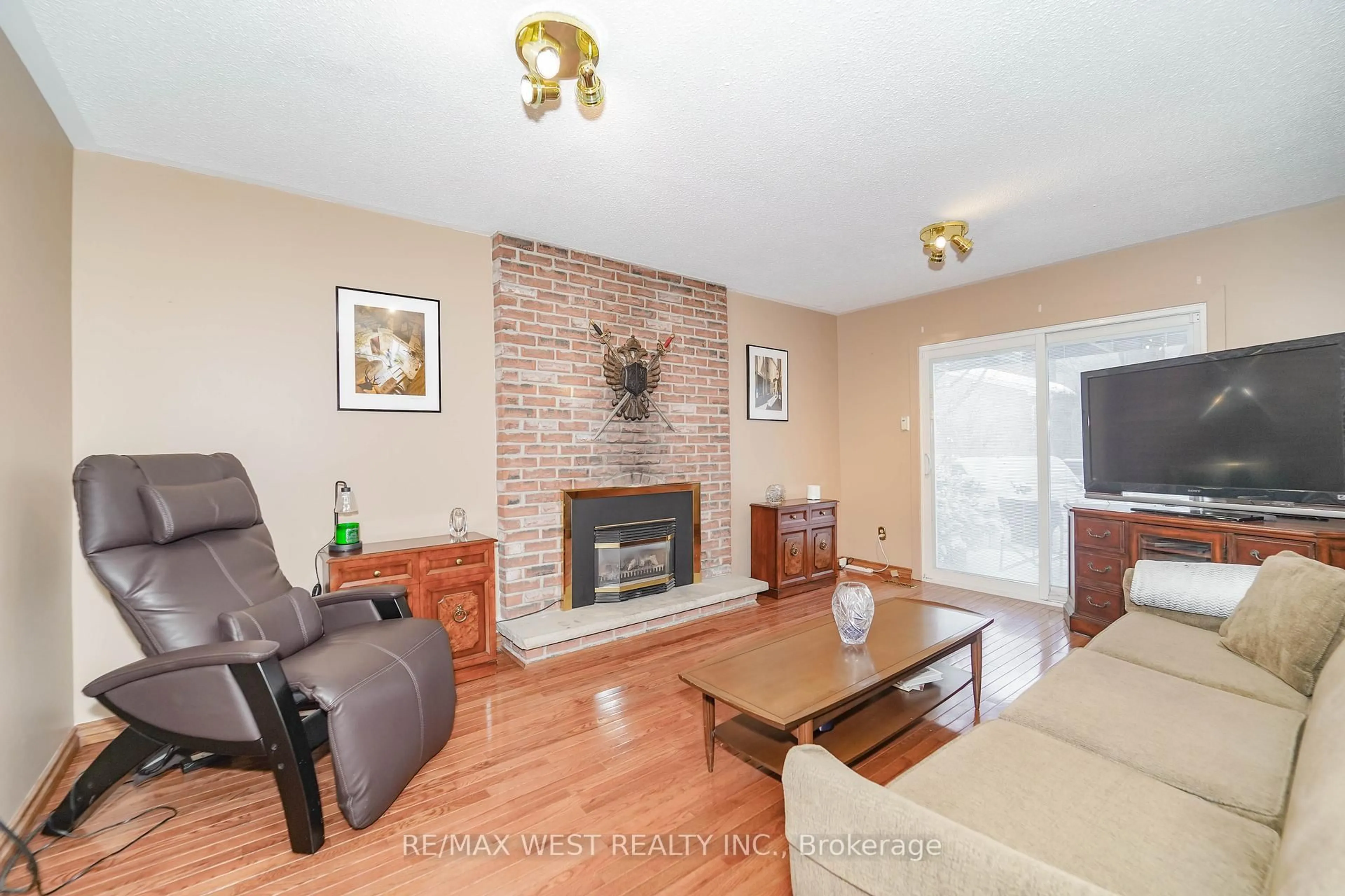 Living room with furniture, wood/laminate floor for 42 Belgreen Ave, Toronto Ontario M1S 1G4