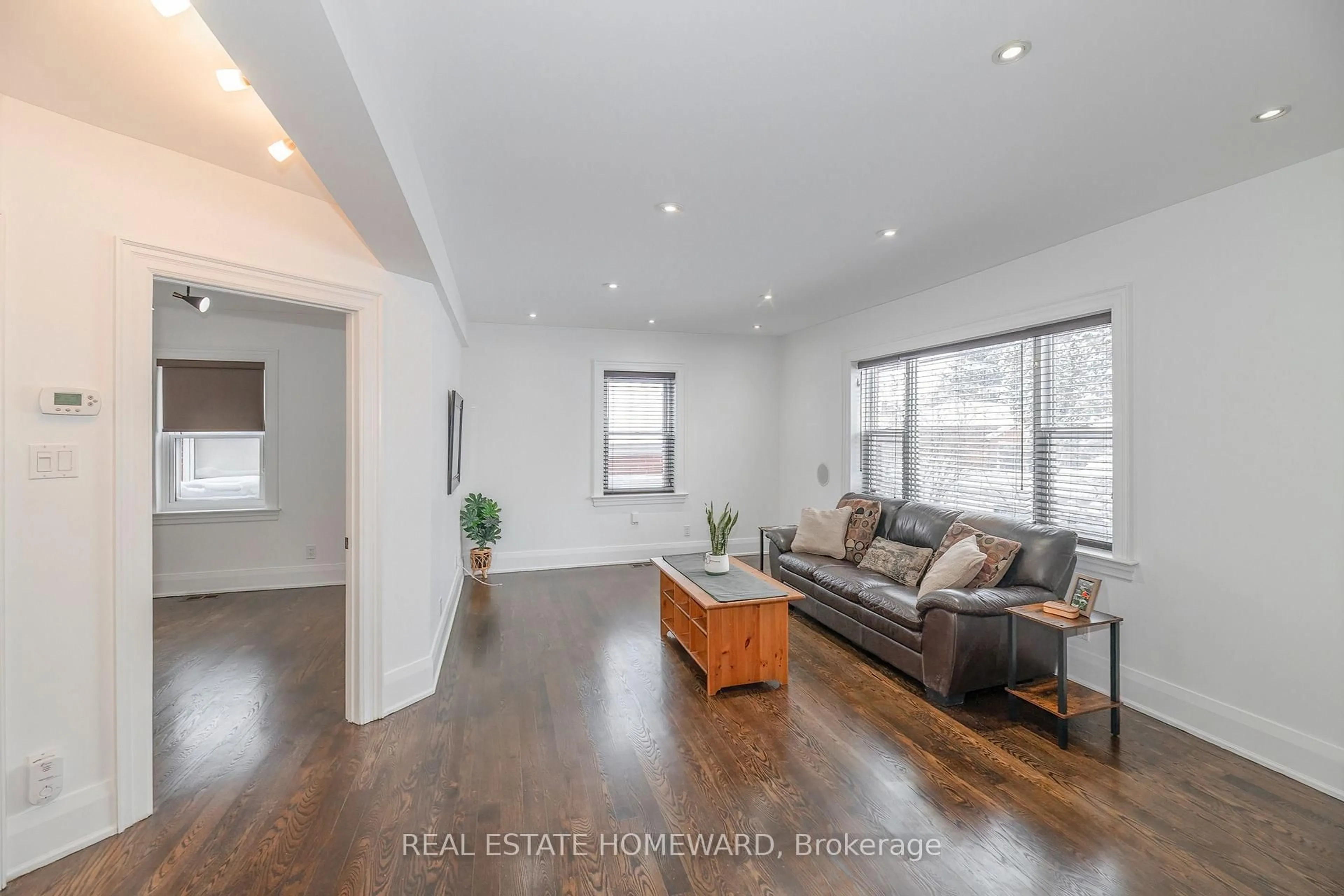 Living room with furniture, wood/laminate floor for 237 Ferris Rd, Toronto Ontario M4B 1H2