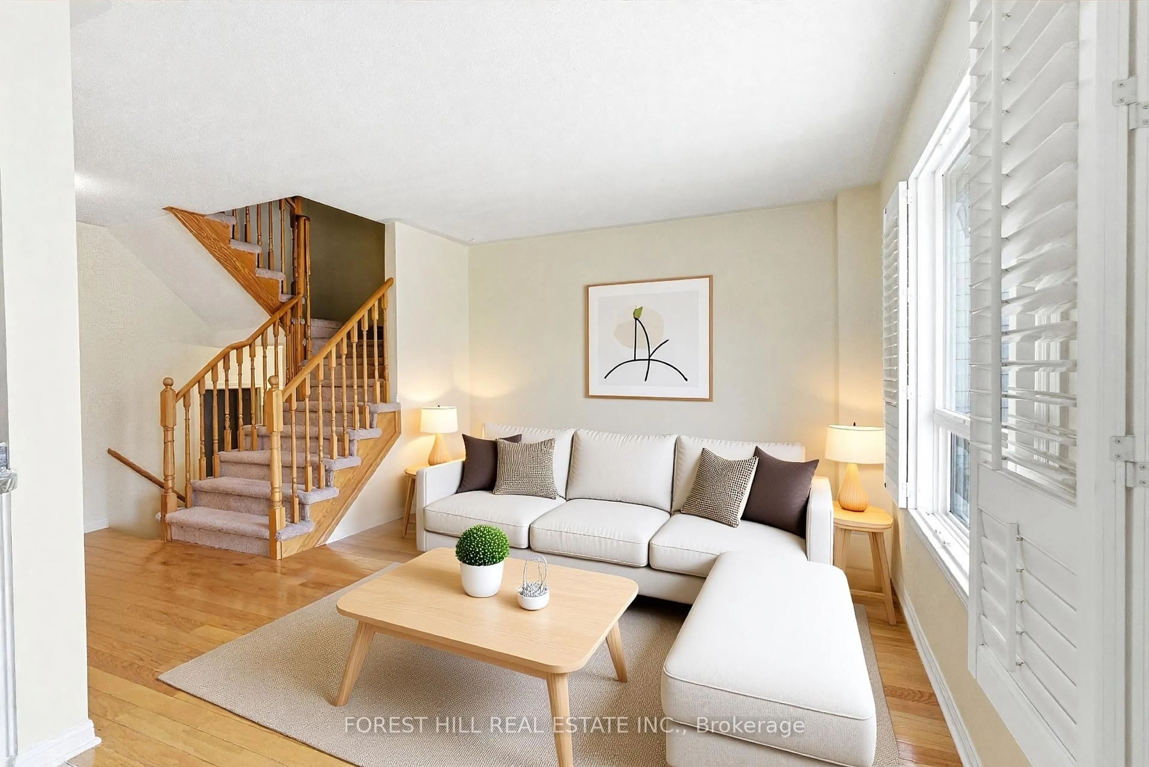 Living room with furniture, wood/laminate floor for 38 Bayside Gate, Whitby Ontario L1N 9T1