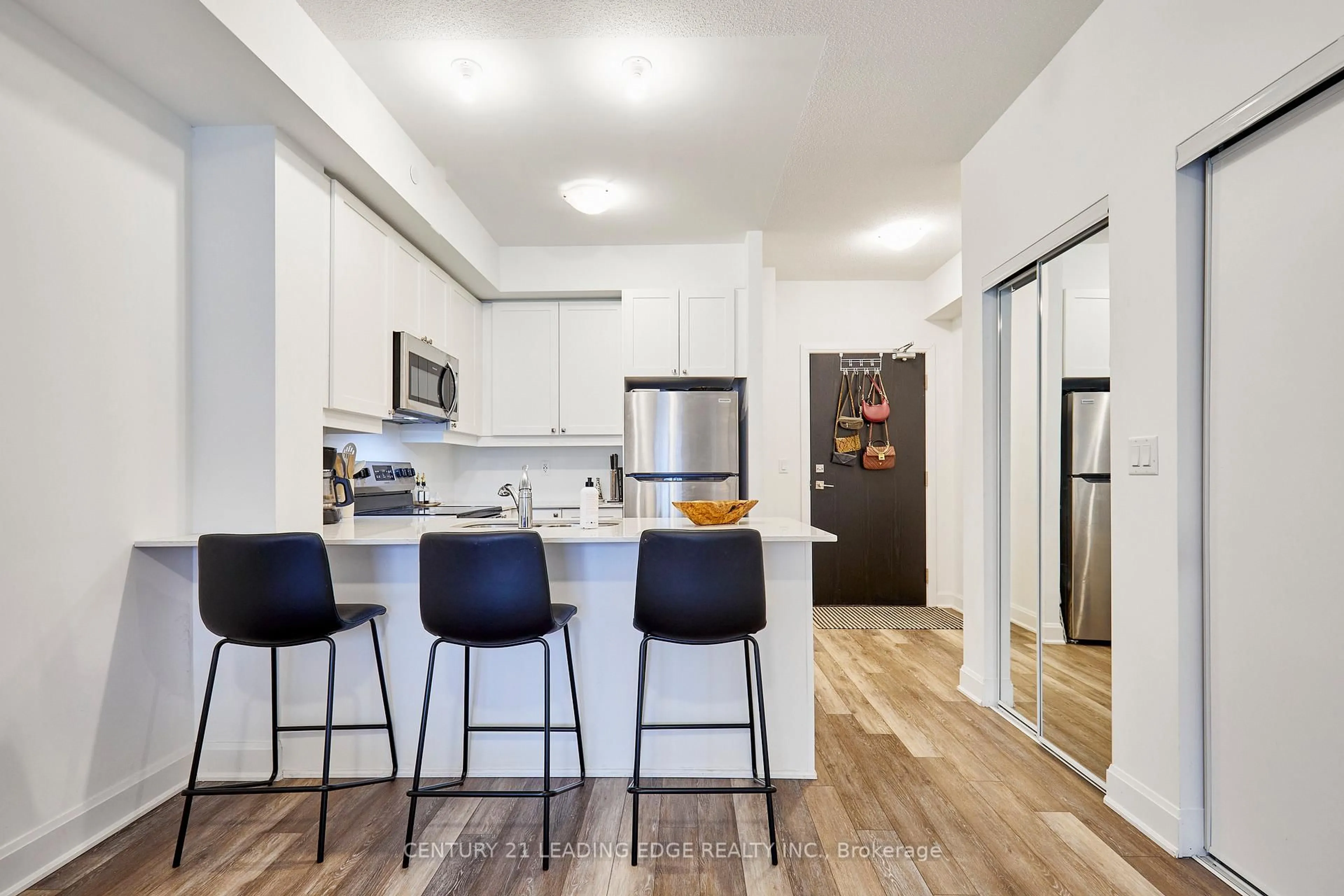 Open concept kitchen, wood/laminate floor for 50 Lakebreeze Dr #105, Clarington Ontario L1B 0V9