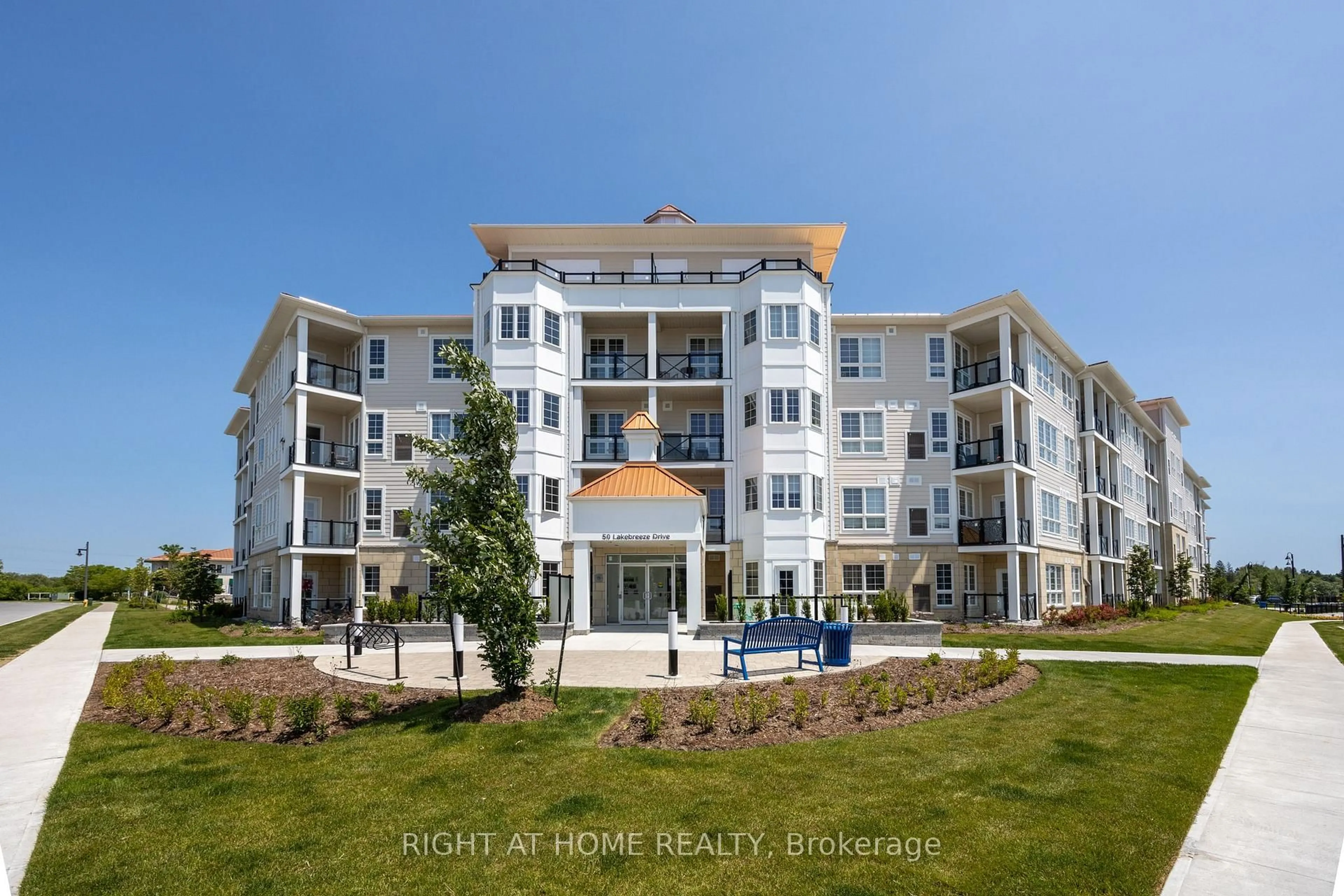 A pic from outside/outdoor area/front of a property/back of a property/a pic from drone, water/lake/river/ocean view for 50 Lakebreeze Dr #402, Clarington Ontario L1B 0V9