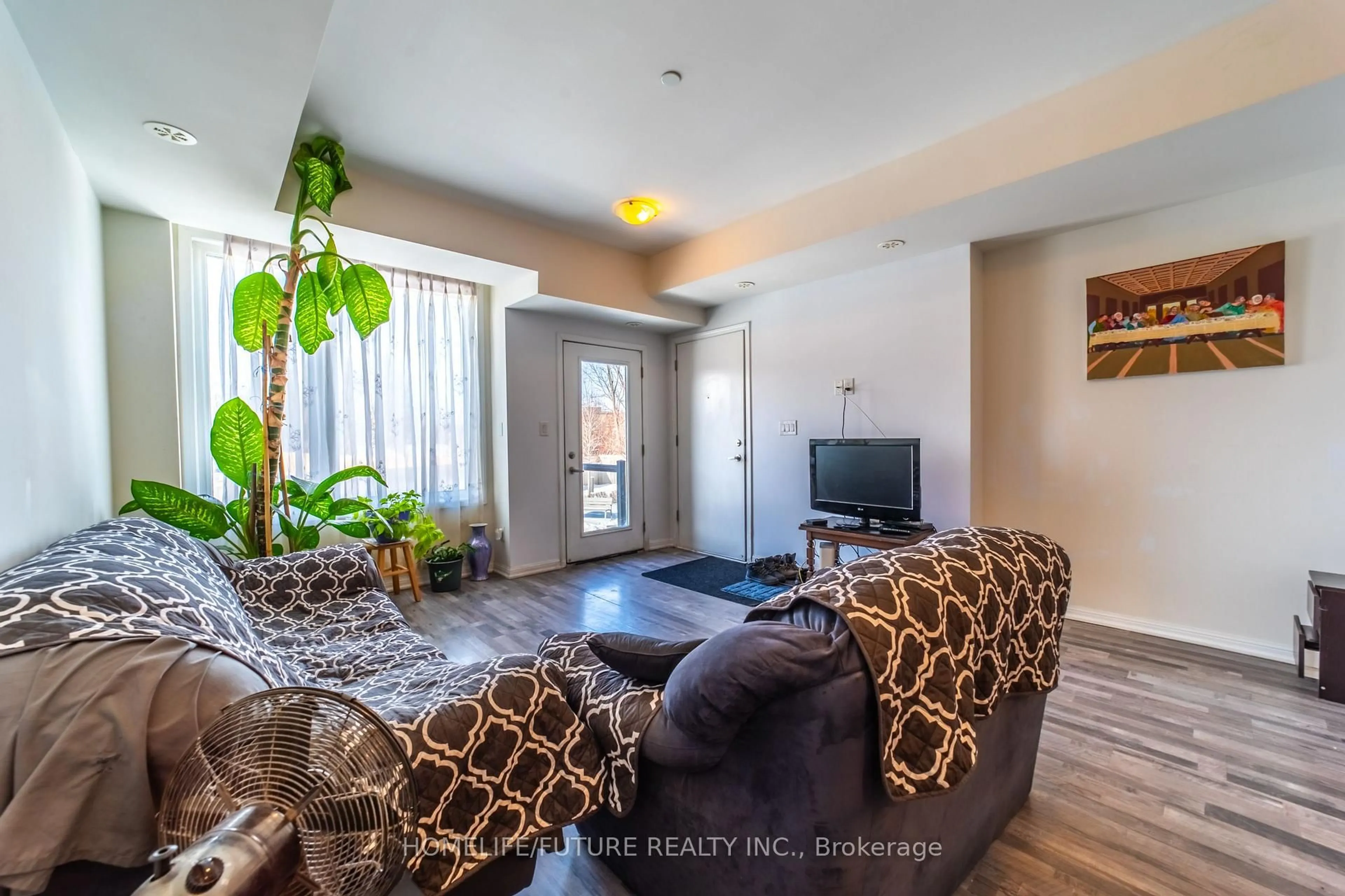 Living room with furniture, unknown for 1460 Whites Rd #413, Pickering Ontario L1V 0E8