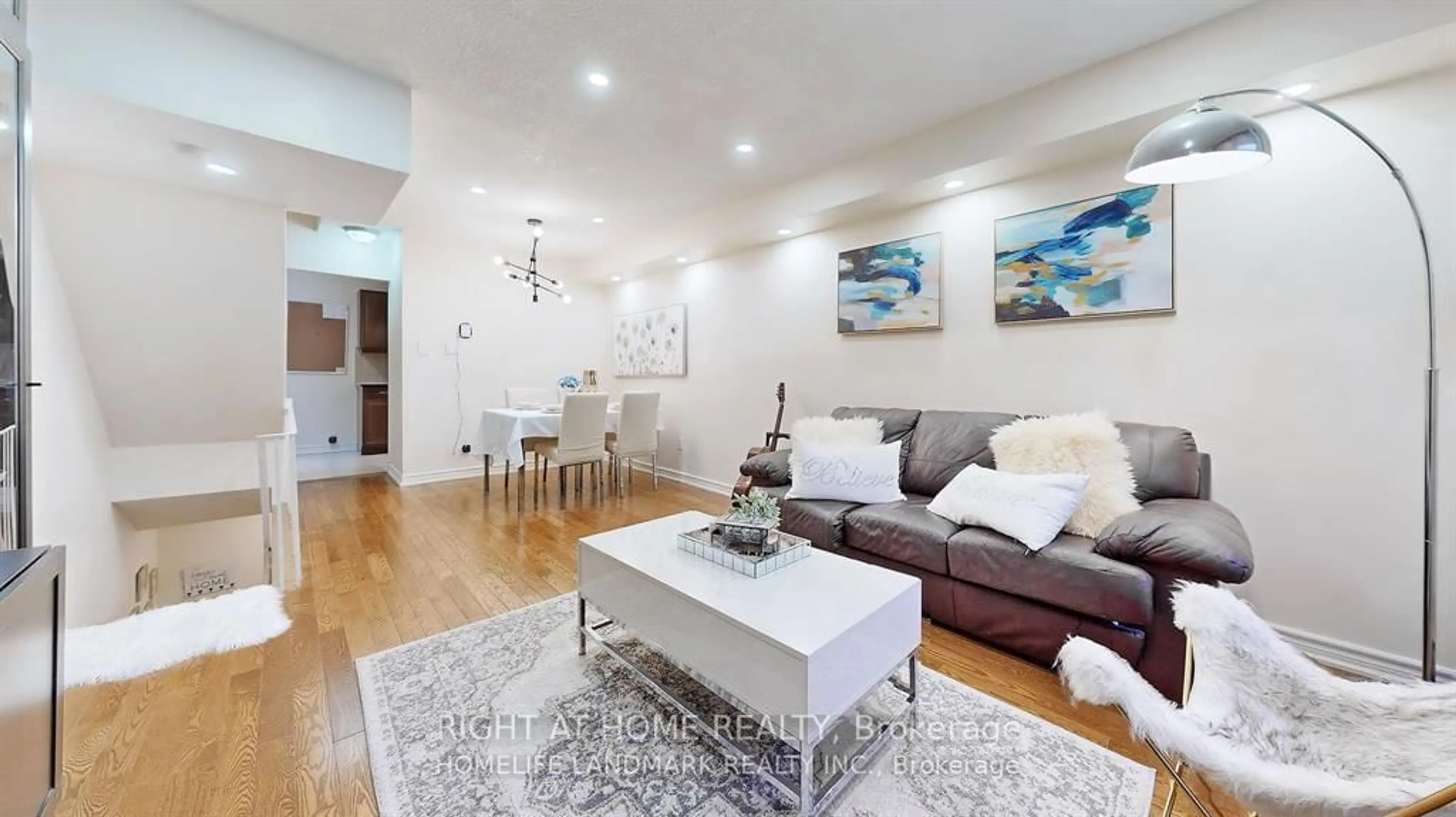 Living room with furniture, wood/laminate floor for 1209 Queen St #82, Toronto Ontario M4M 3H4