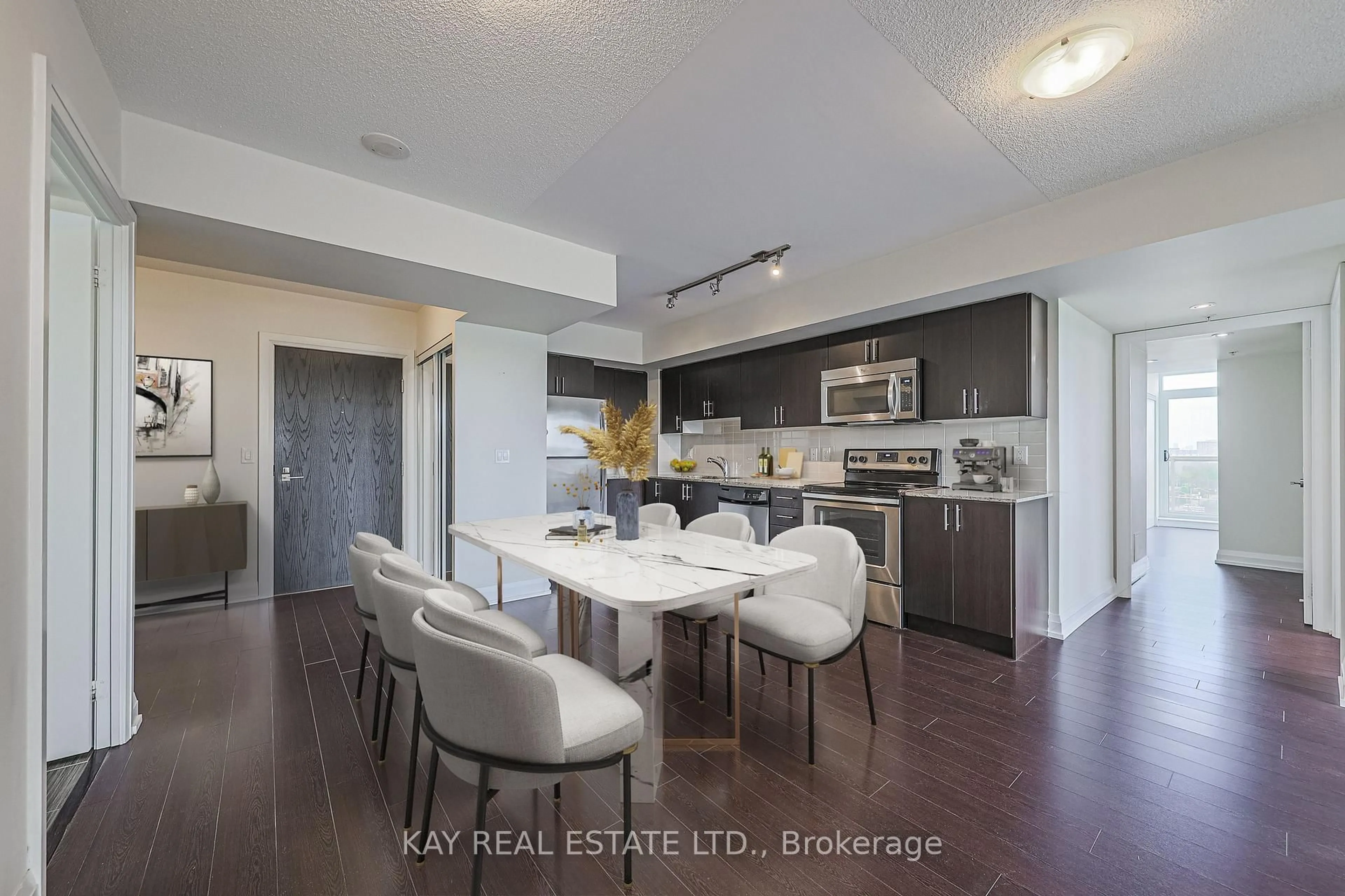 Open concept kitchen, wood/laminate floor for 3520 Danforth Ave #612, Toronto Ontario M1L 1E5