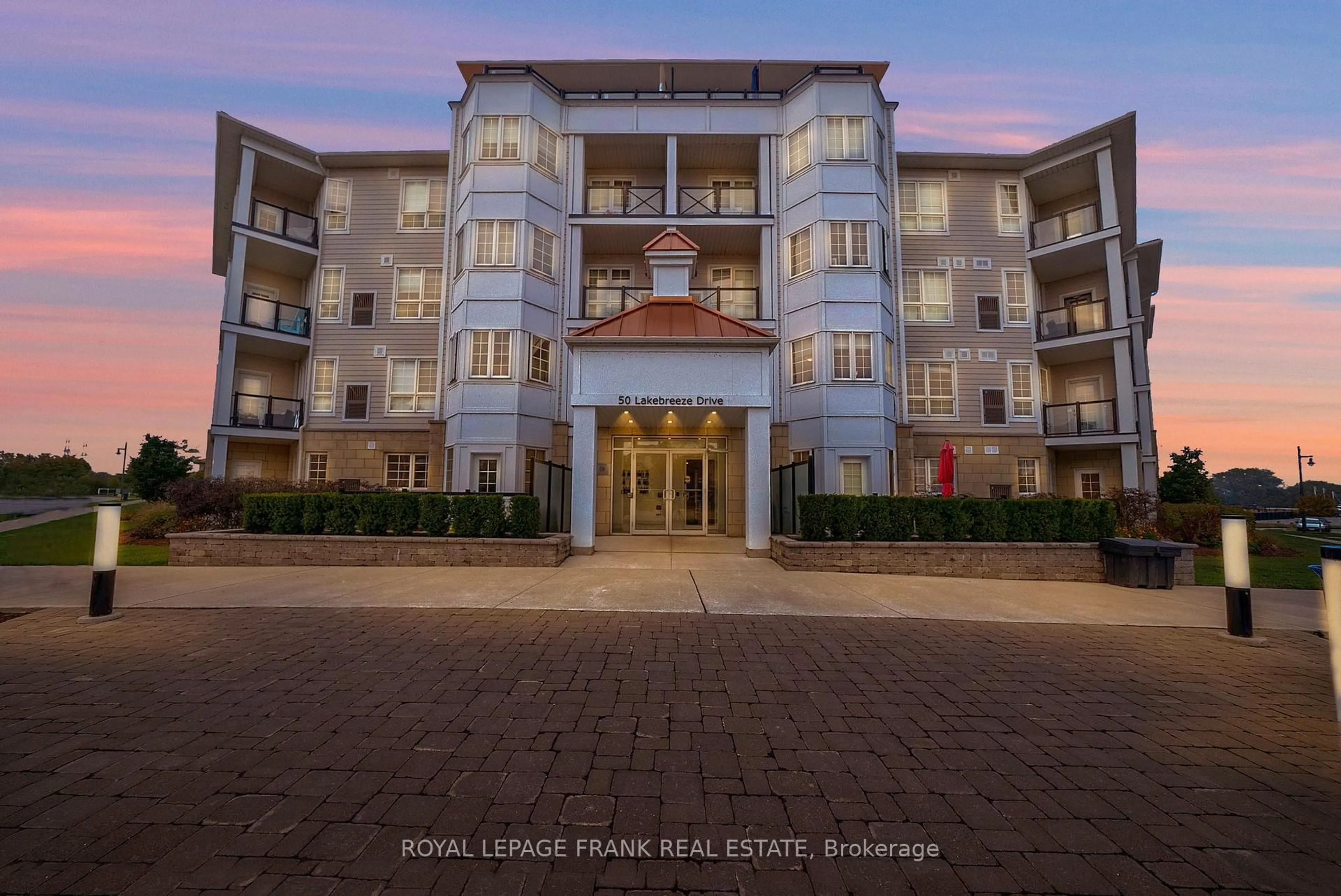 A pic from outside/outdoor area/front of a property/back of a property/a pic from drone, water/lake/river/ocean view for 50 Lakebreeze Dr #216, Clarington Ontario L1B 0V9