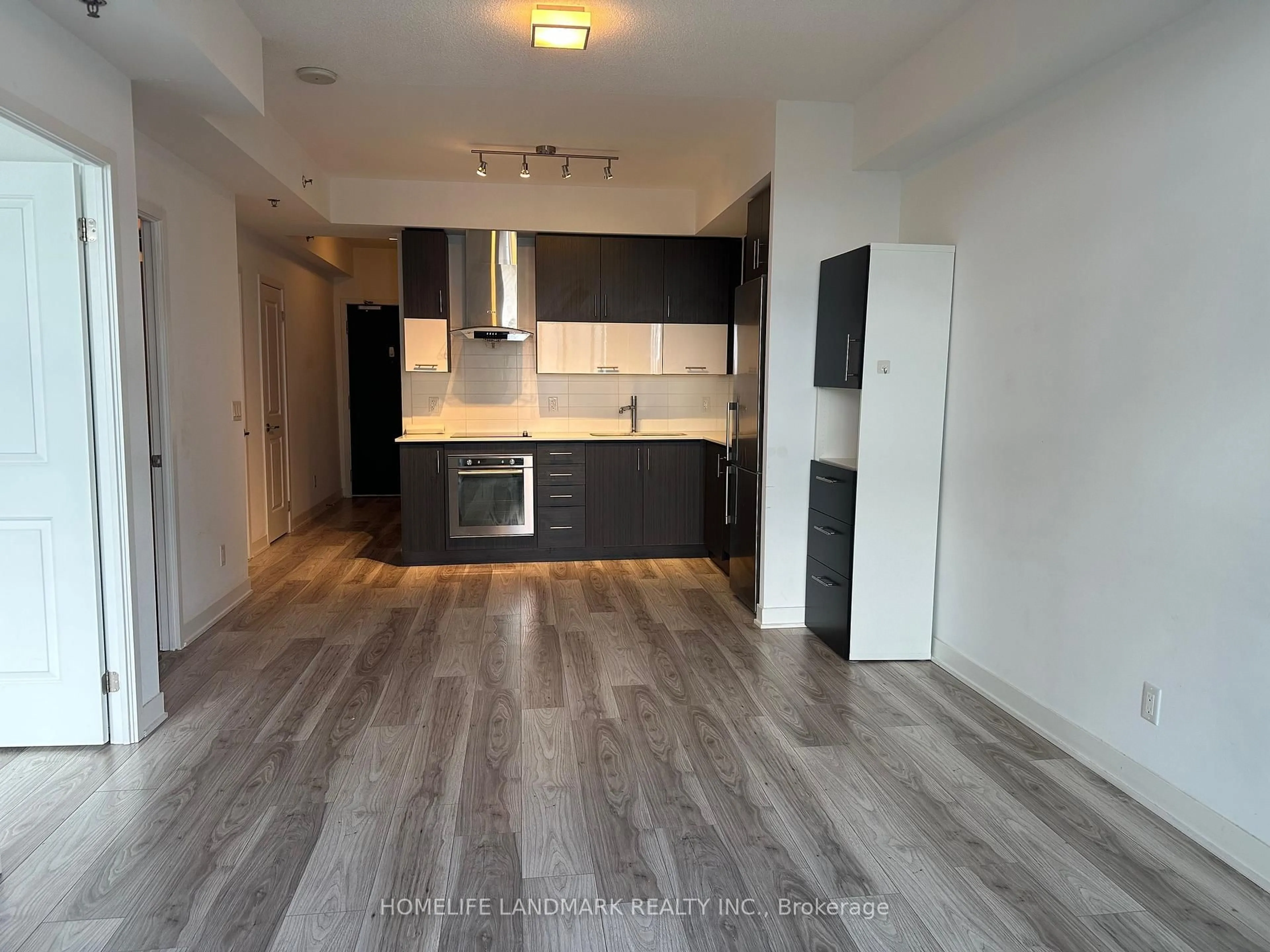 Open concept kitchen, wood/laminate floor for 195 Bonis Ave #1809, Toronto Ontario M1T 0A5
