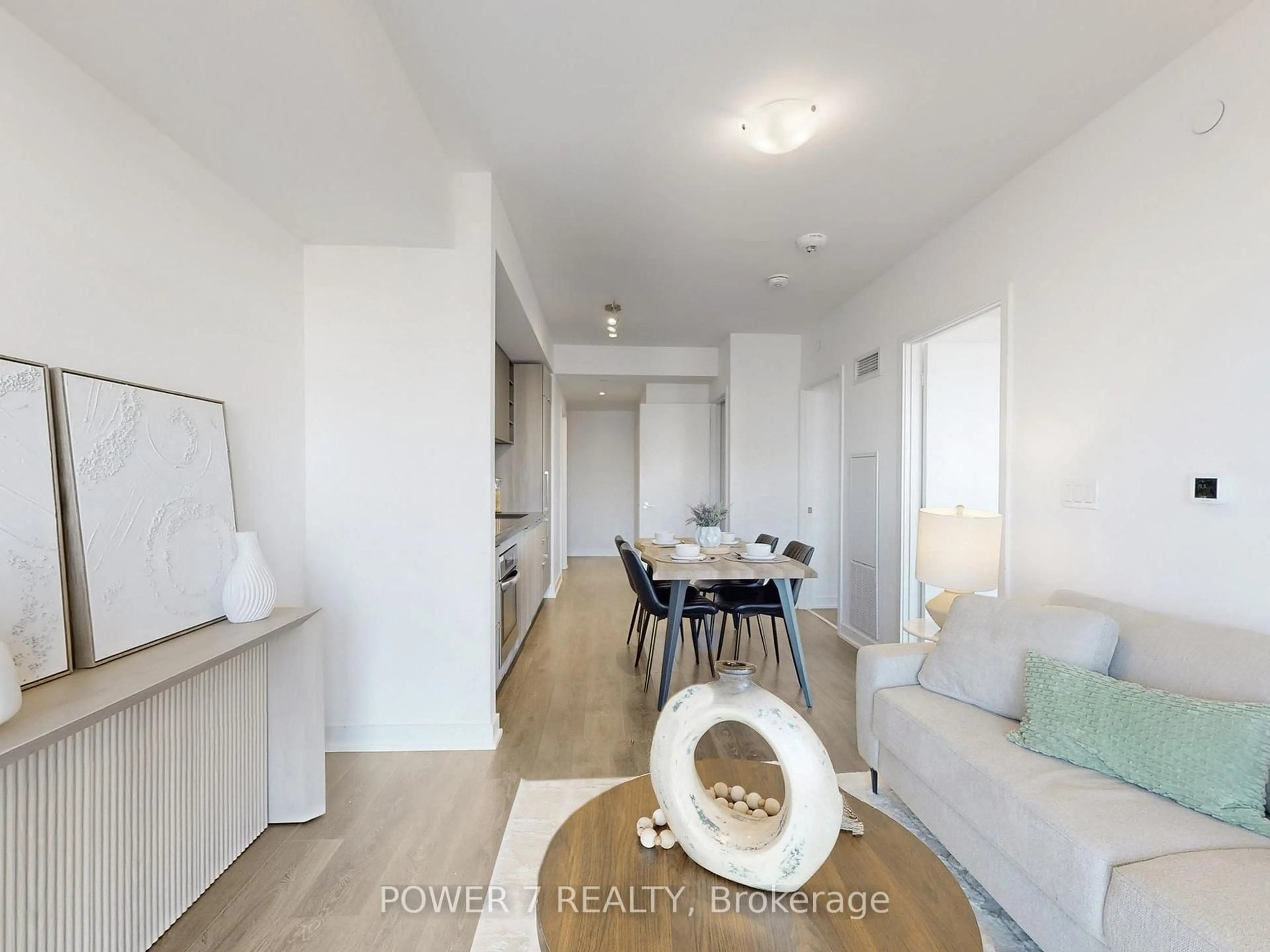 Living room with furniture, wood/laminate floor for 2033 Kennedy Rd #3605, Toronto Ontario M1T 0B9