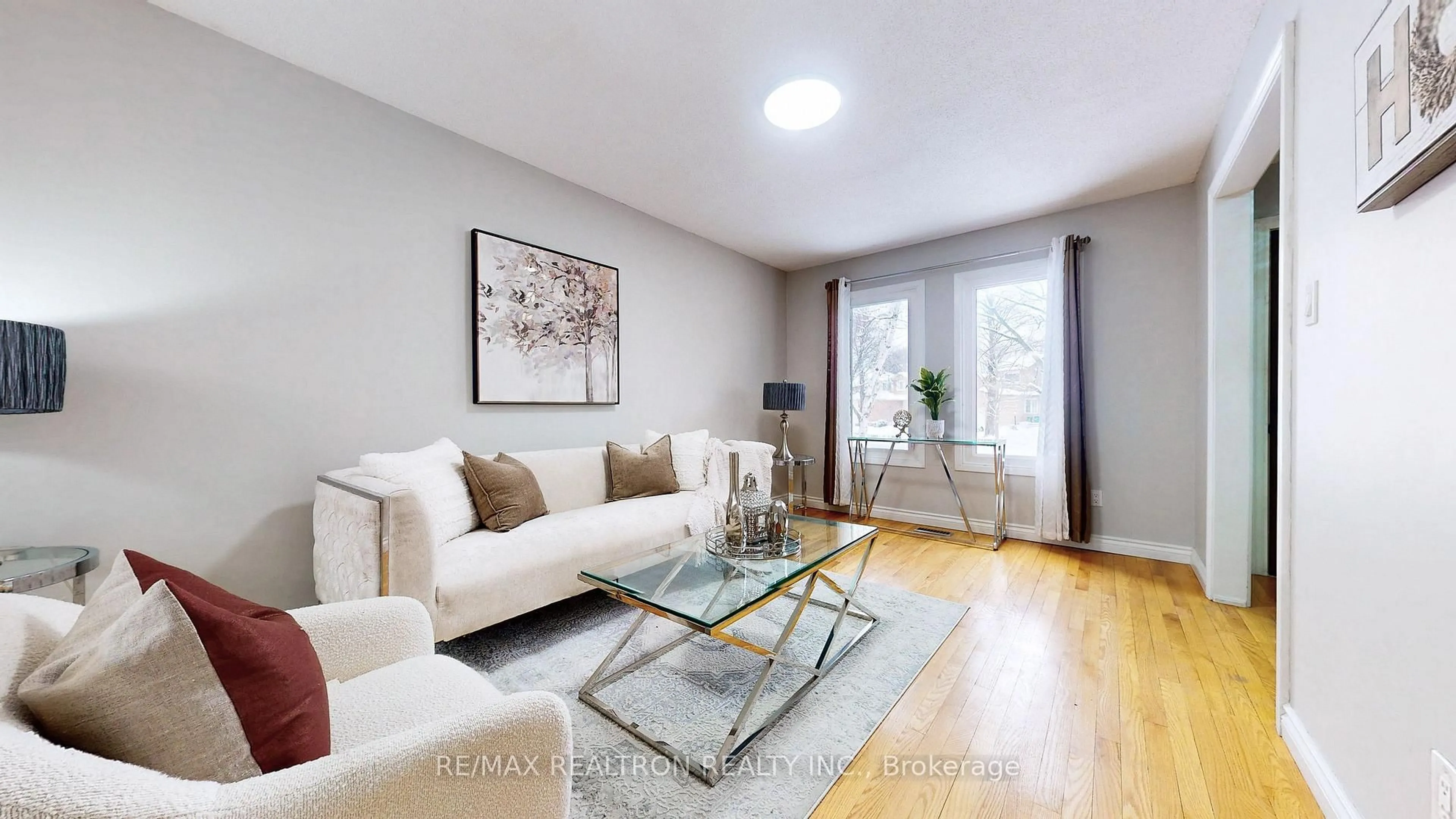 Living room with furniture, wood/laminate floor for 27 Ventris Dr, Ajax Ontario L1T 1V1