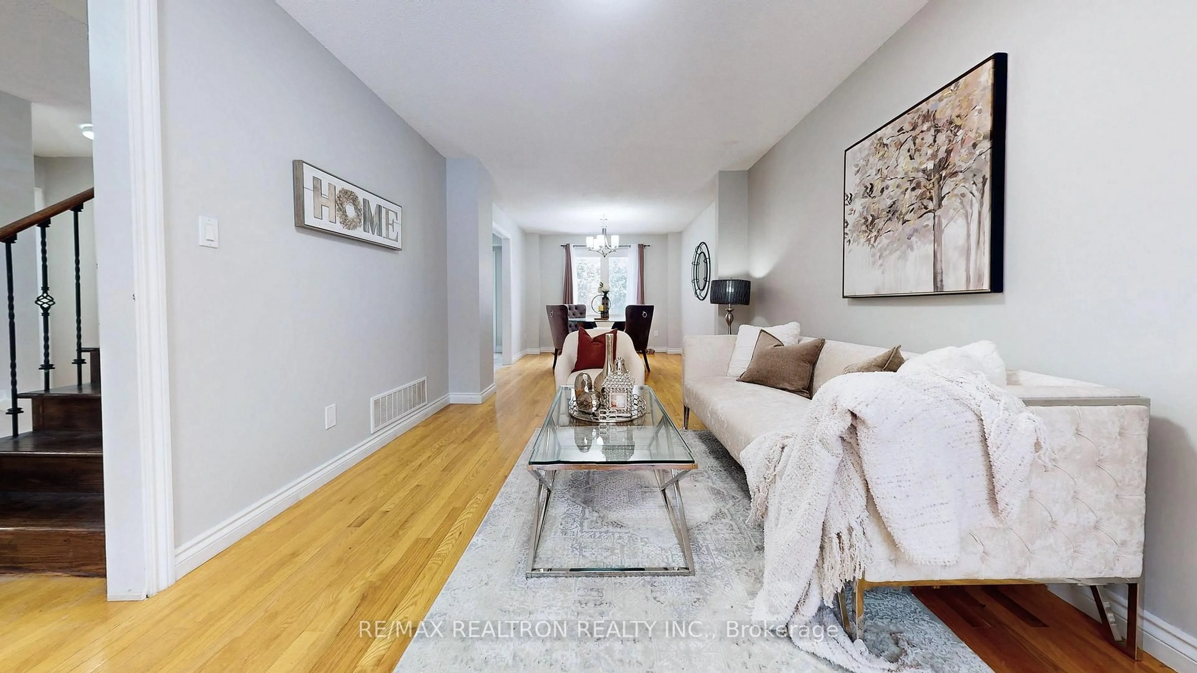 Living room with furniture, wood/laminate floor for 27 Ventris Dr, Ajax Ontario L1T 1V1