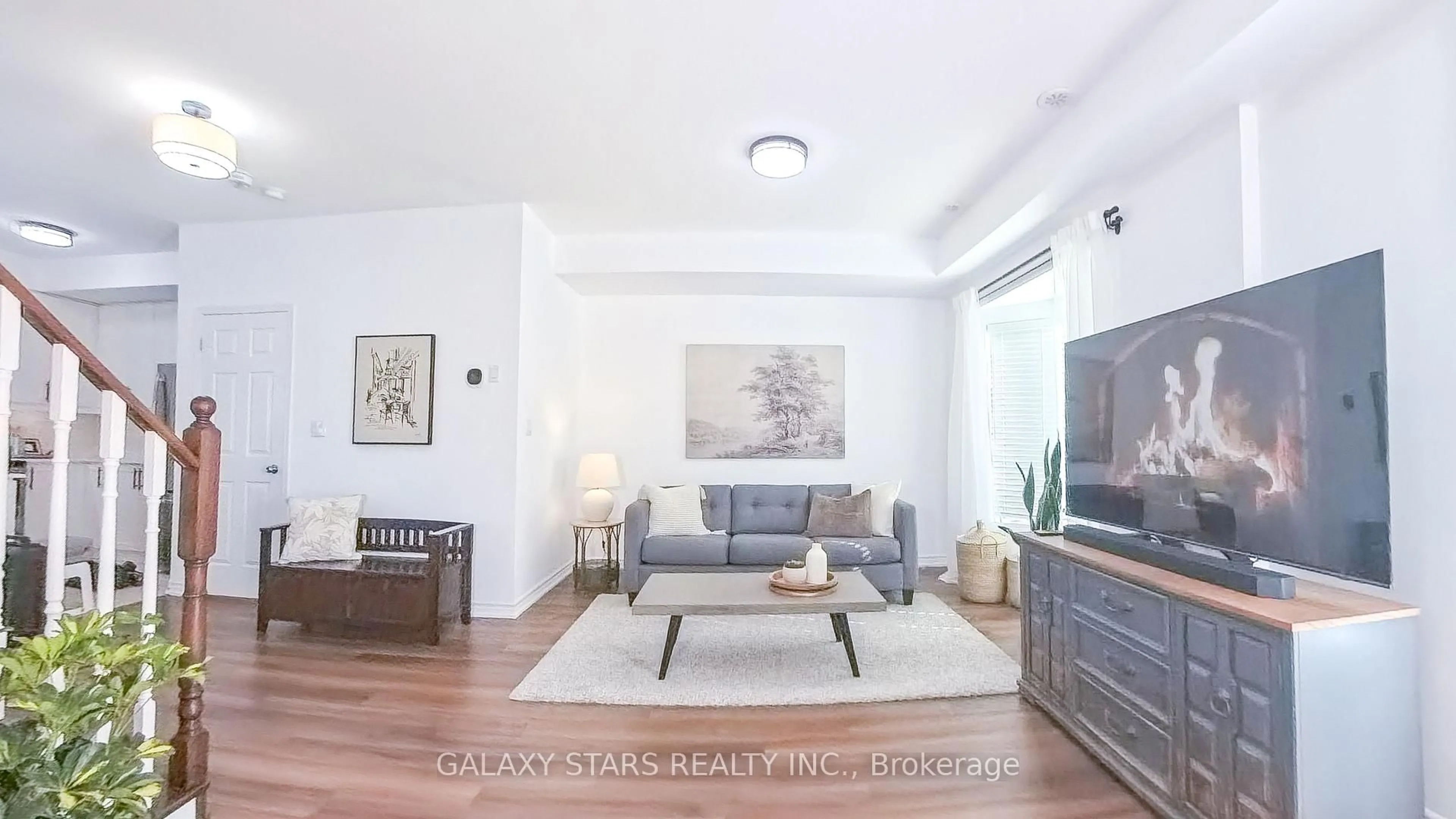 Living room with furniture, wood/laminate floor for 1050 Elton Way #8, Whitby Ontario L1N 0L3