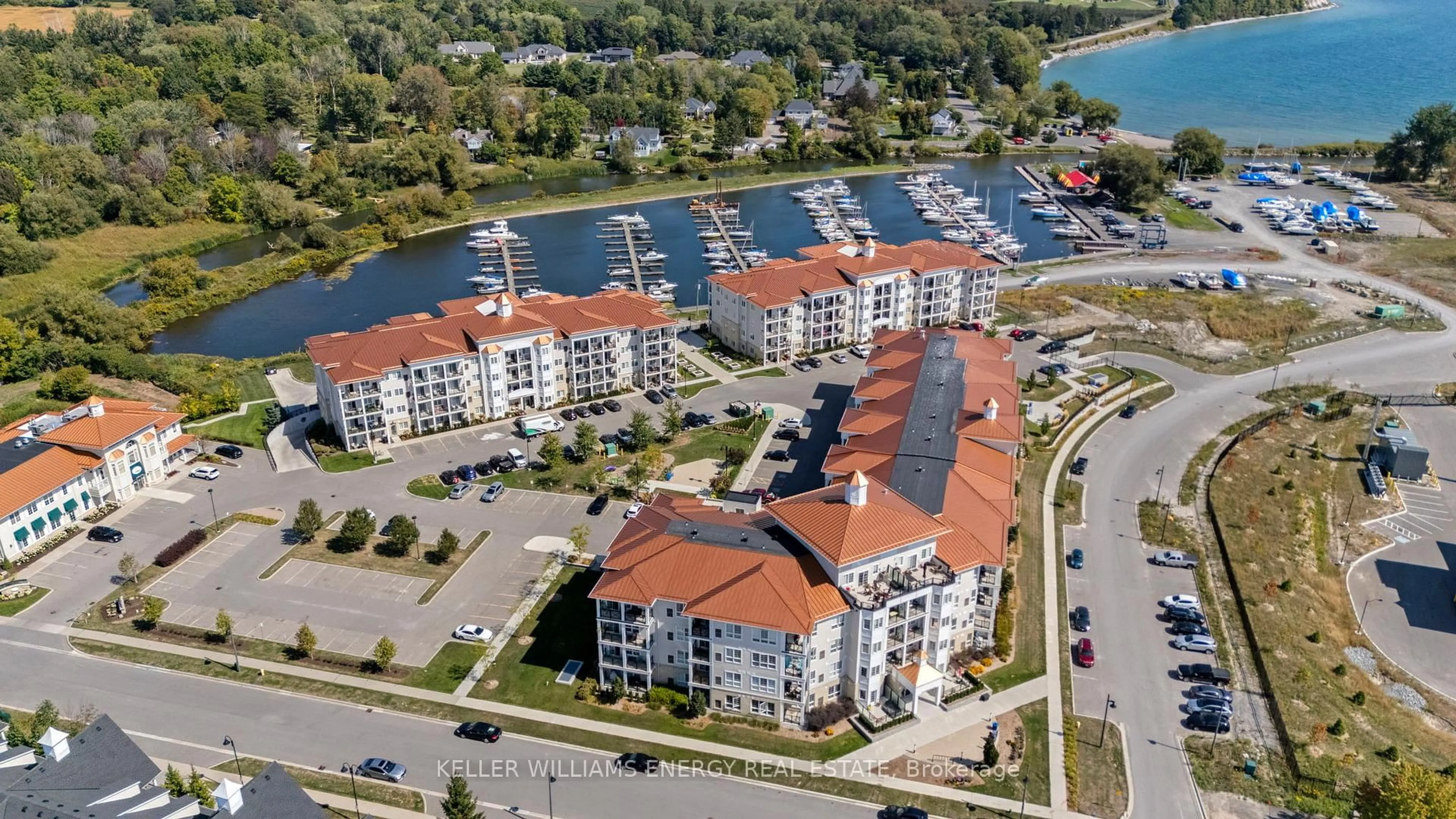 A pic from outside/outdoor area/front of a property/back of a property/a pic from drone, water/lake/river/ocean view for 50 Lakebreeze Dr #106, Clarington Ontario L1B 0V9