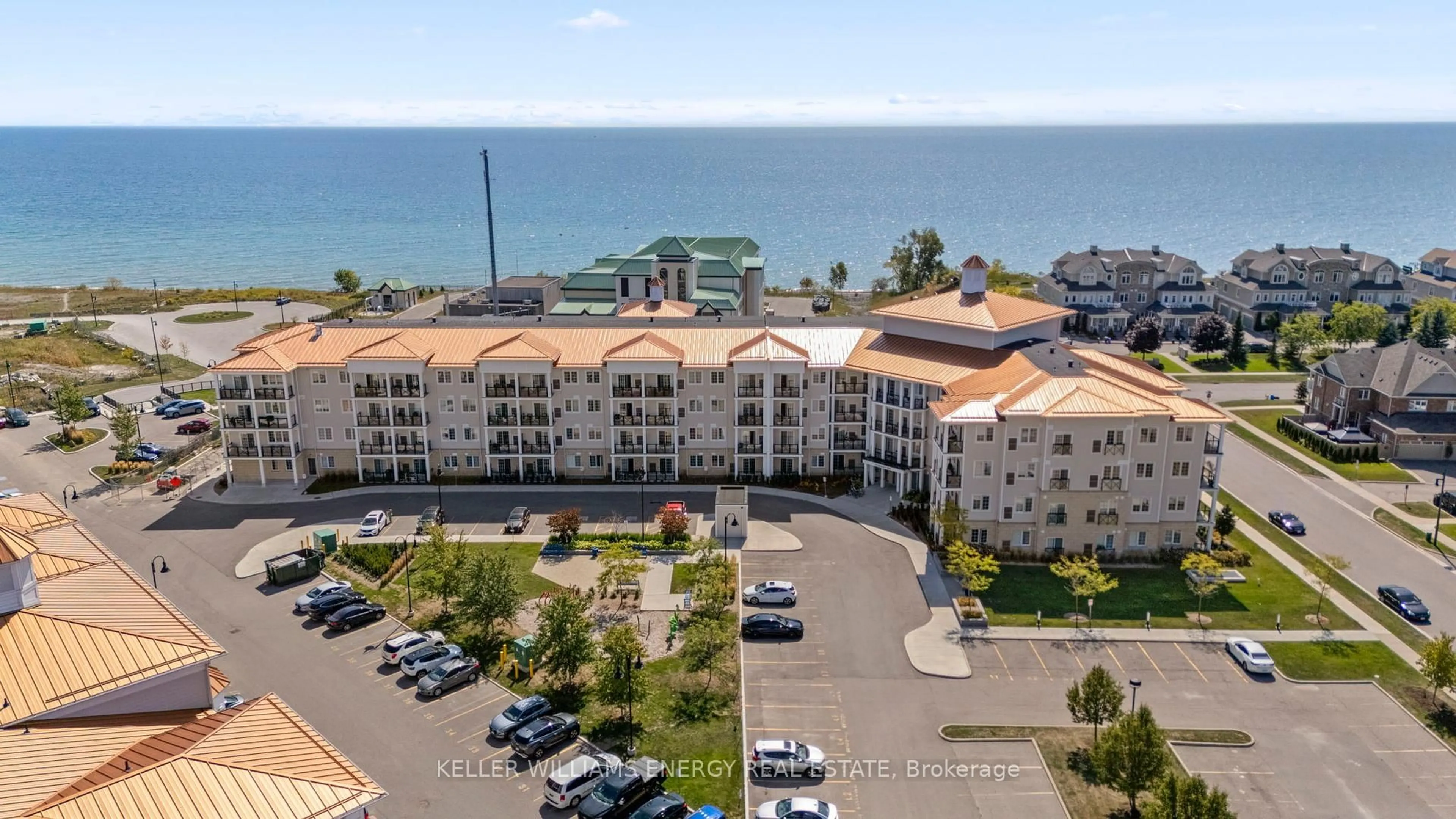 A pic from outside/outdoor area/front of a property/back of a property/a pic from drone, water/lake/river/ocean view for 50 Lakebreeze Dr #106, Clarington Ontario L1B 0V9