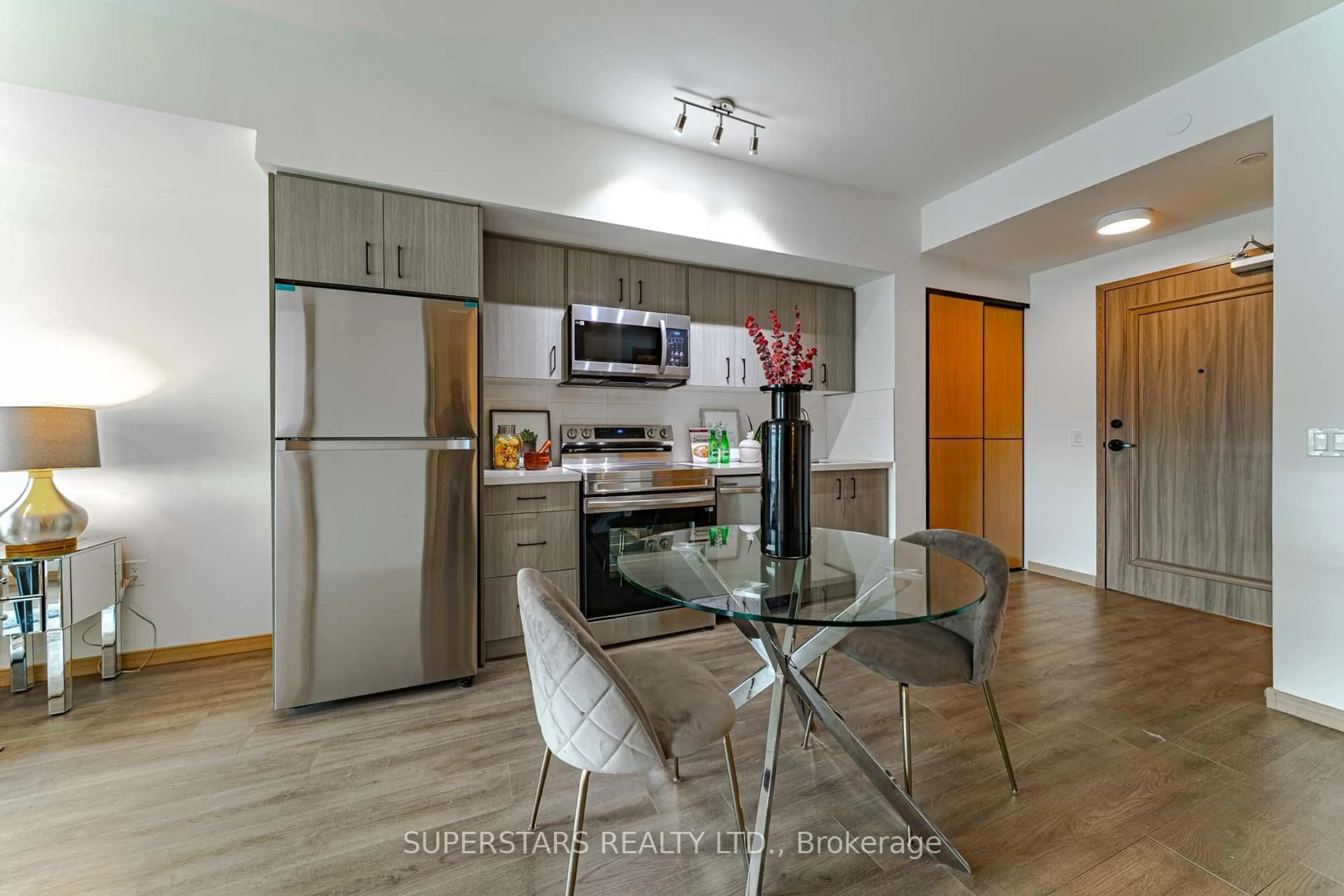 Open concept kitchen, wood/laminate floor for 3429 Sheppard Ave #805, Toronto Ontario M1T 0C2