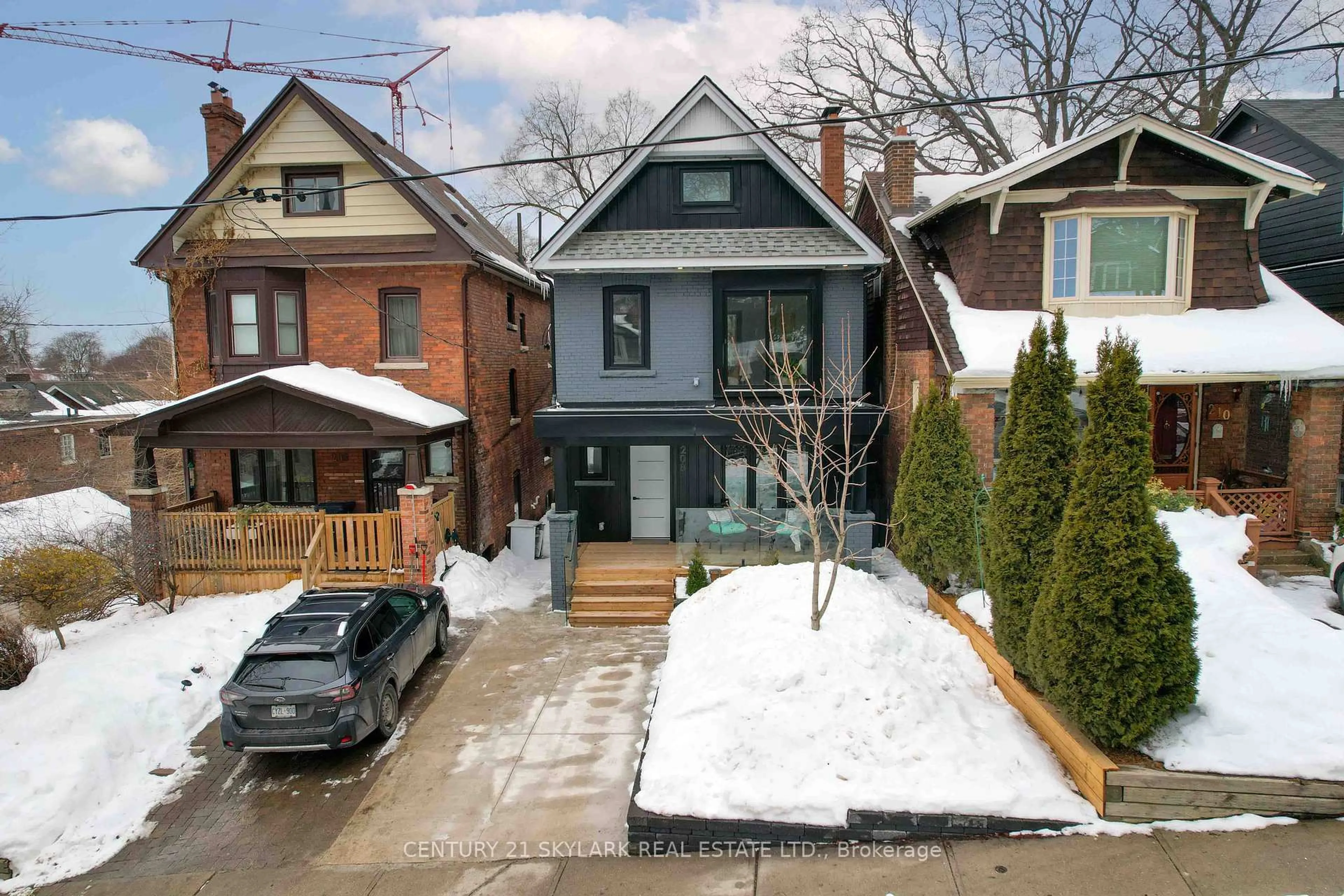 Home with brick exterior material, street for 208 Gainsborough Rd, Toronto Ontario M4L 3C6