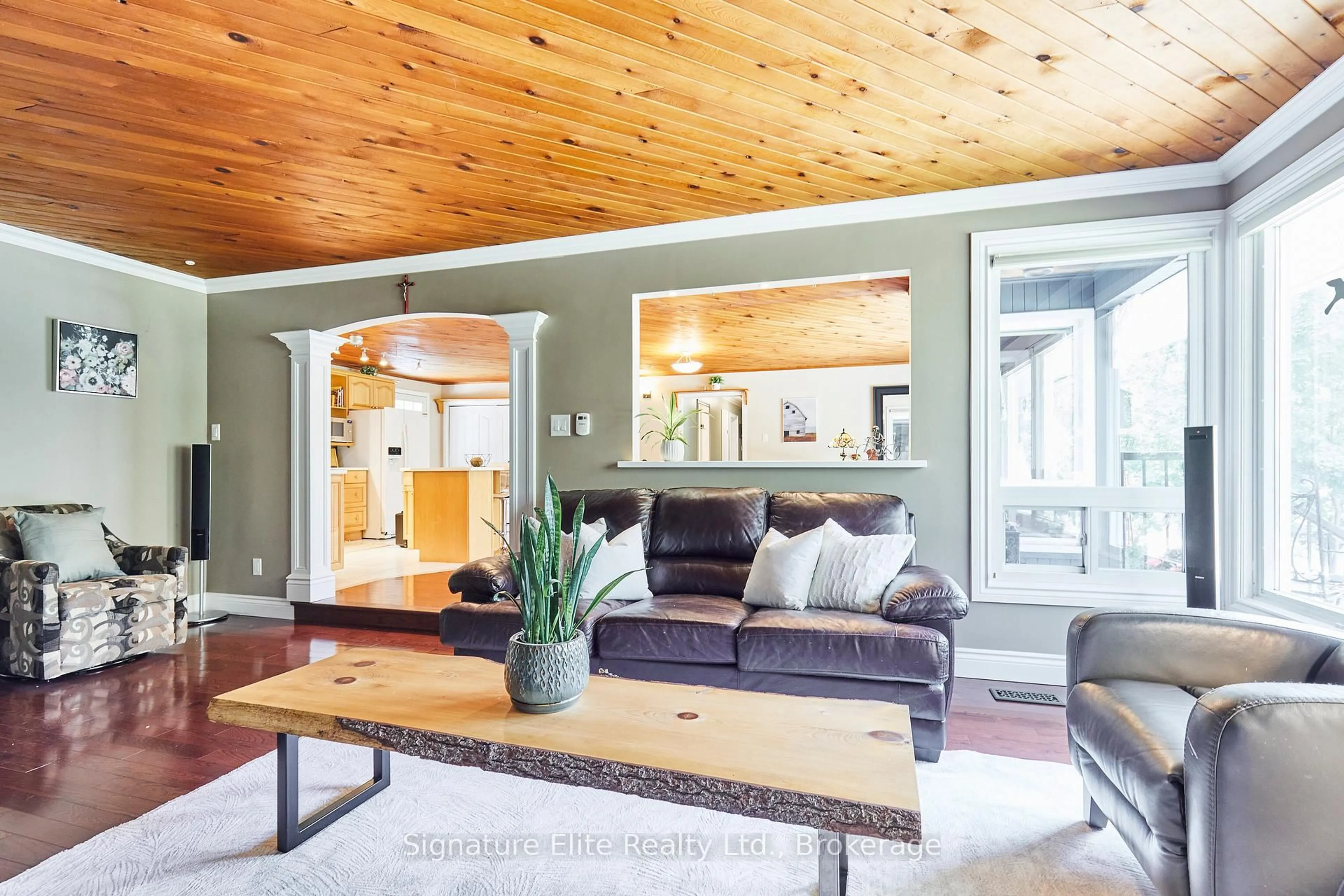 Living room with furniture, wood/laminate floor for 121 Meadow Cres, Whitby Ontario L1N 3J5