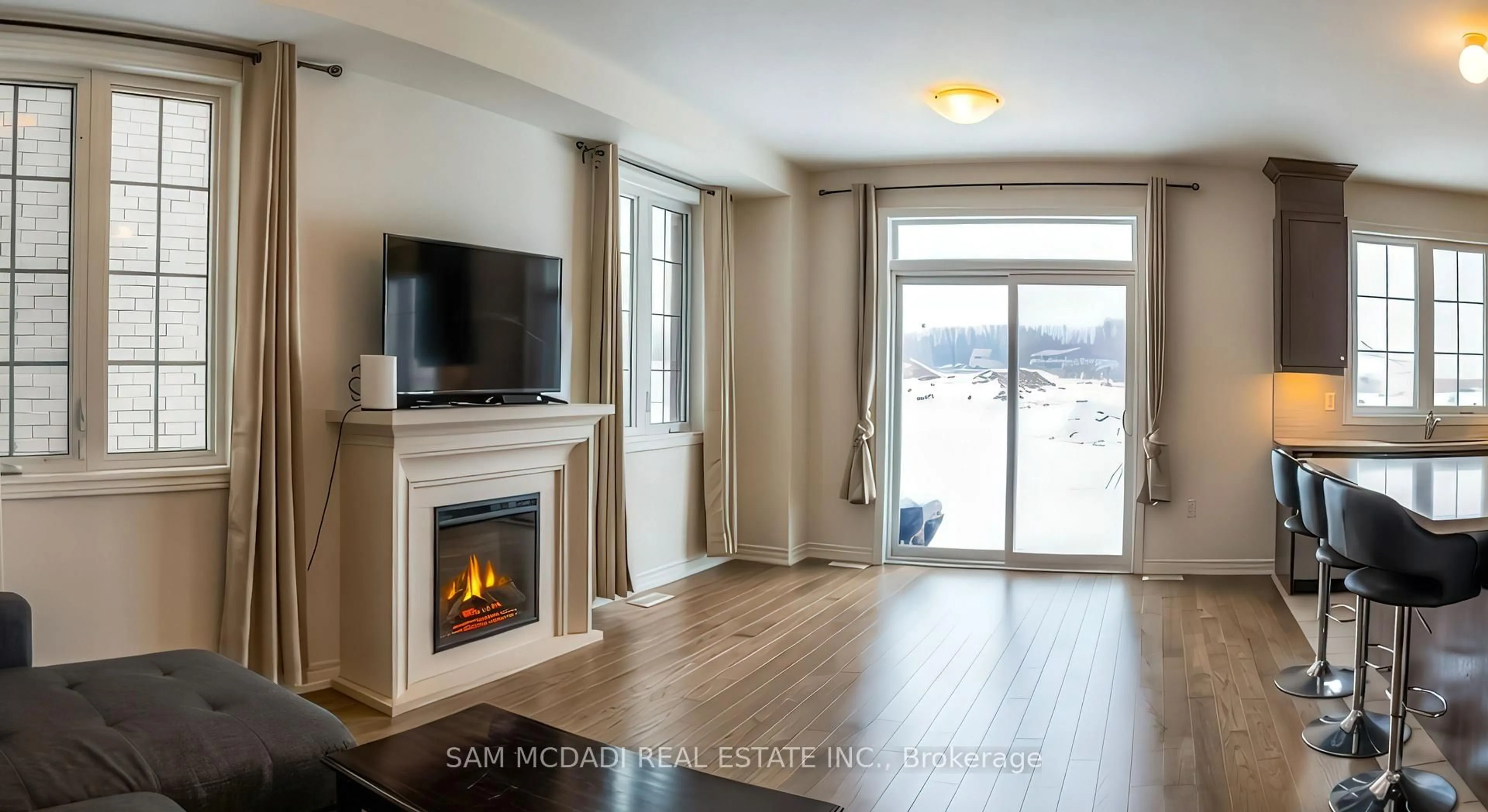 Living room with furniture, wood/laminate floor for 1090 Pisces Tr, Pickering Ontario L1X 0P8