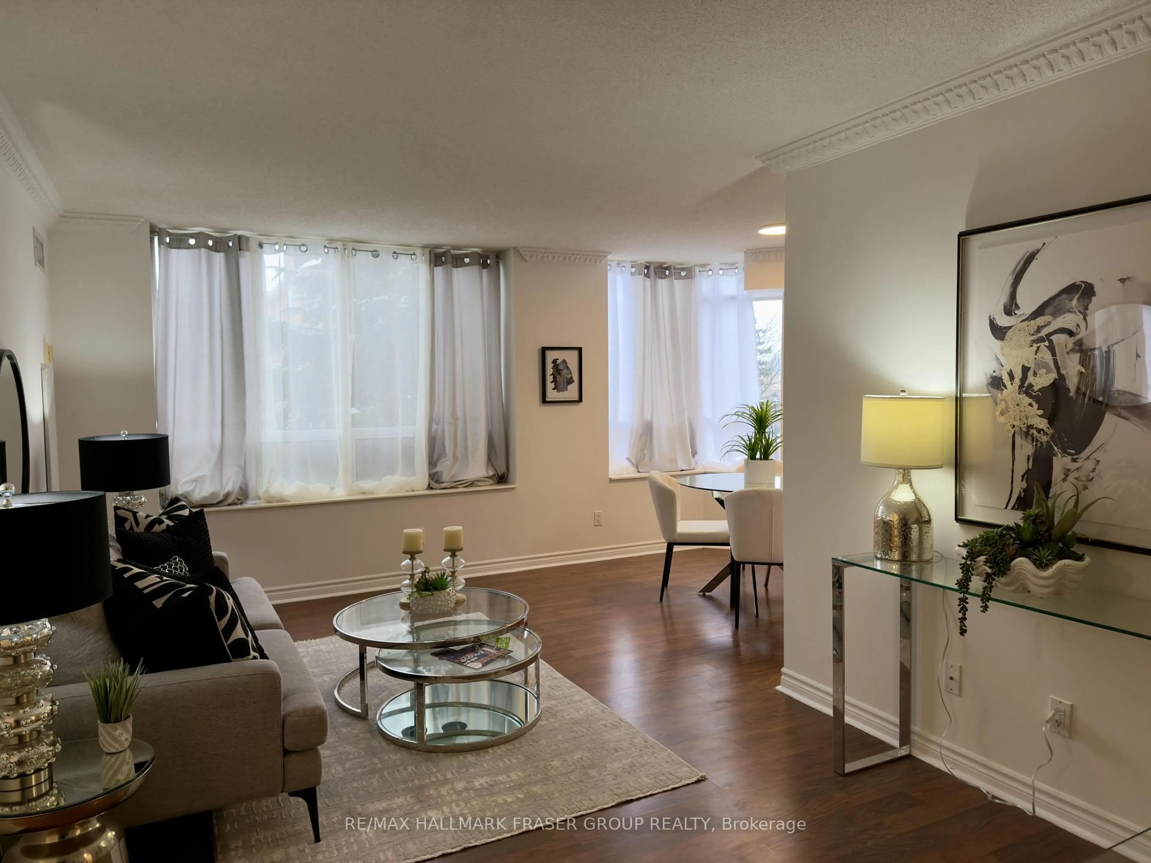 Living room with furniture, unknown for 1883 Mcnicoll Ave #222, Toronto Ontario M1V 5M3