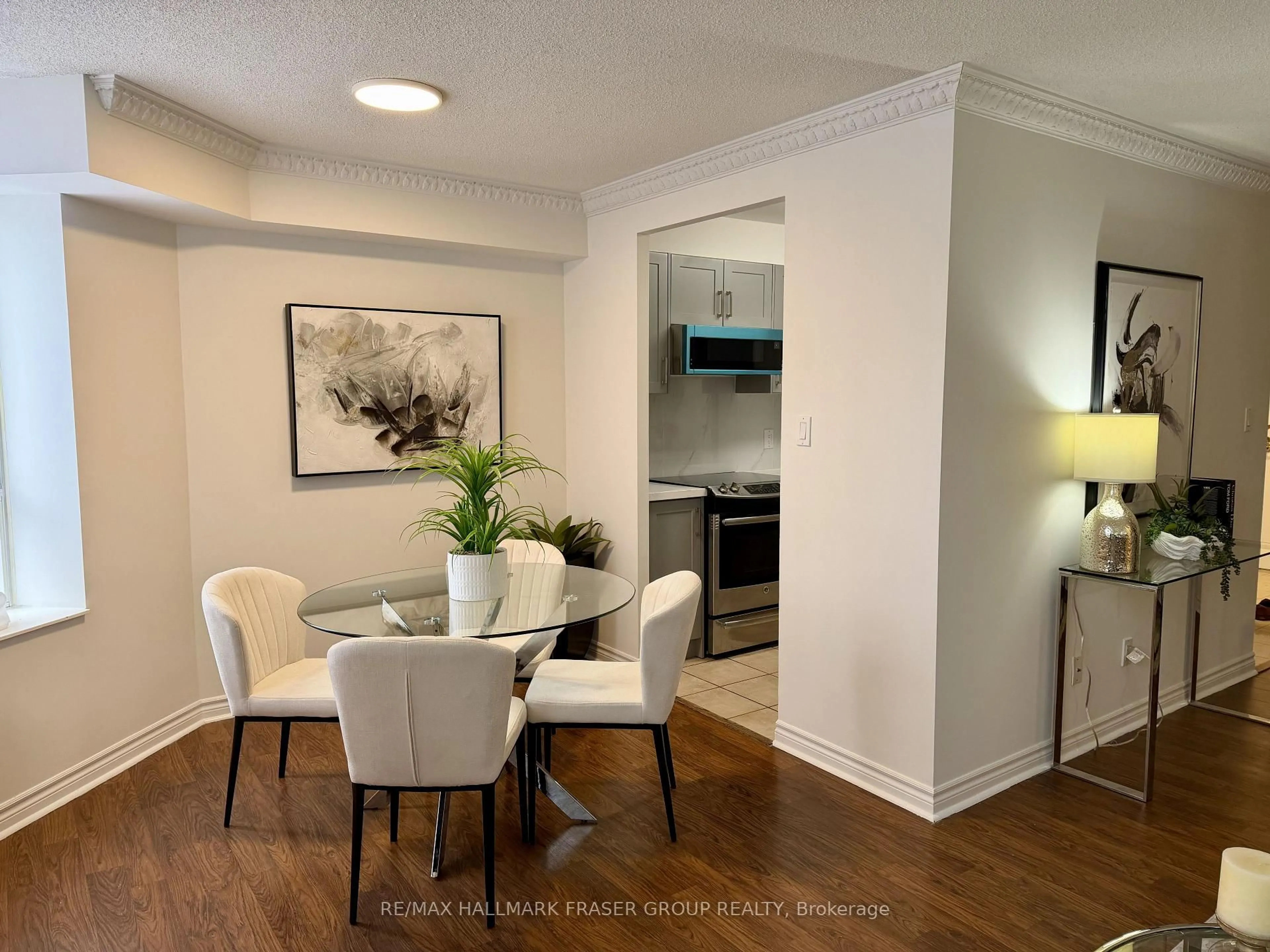 Dining room, wood/laminate floor for 1883 Mcnicoll Ave #222, Toronto Ontario M1V 5M3