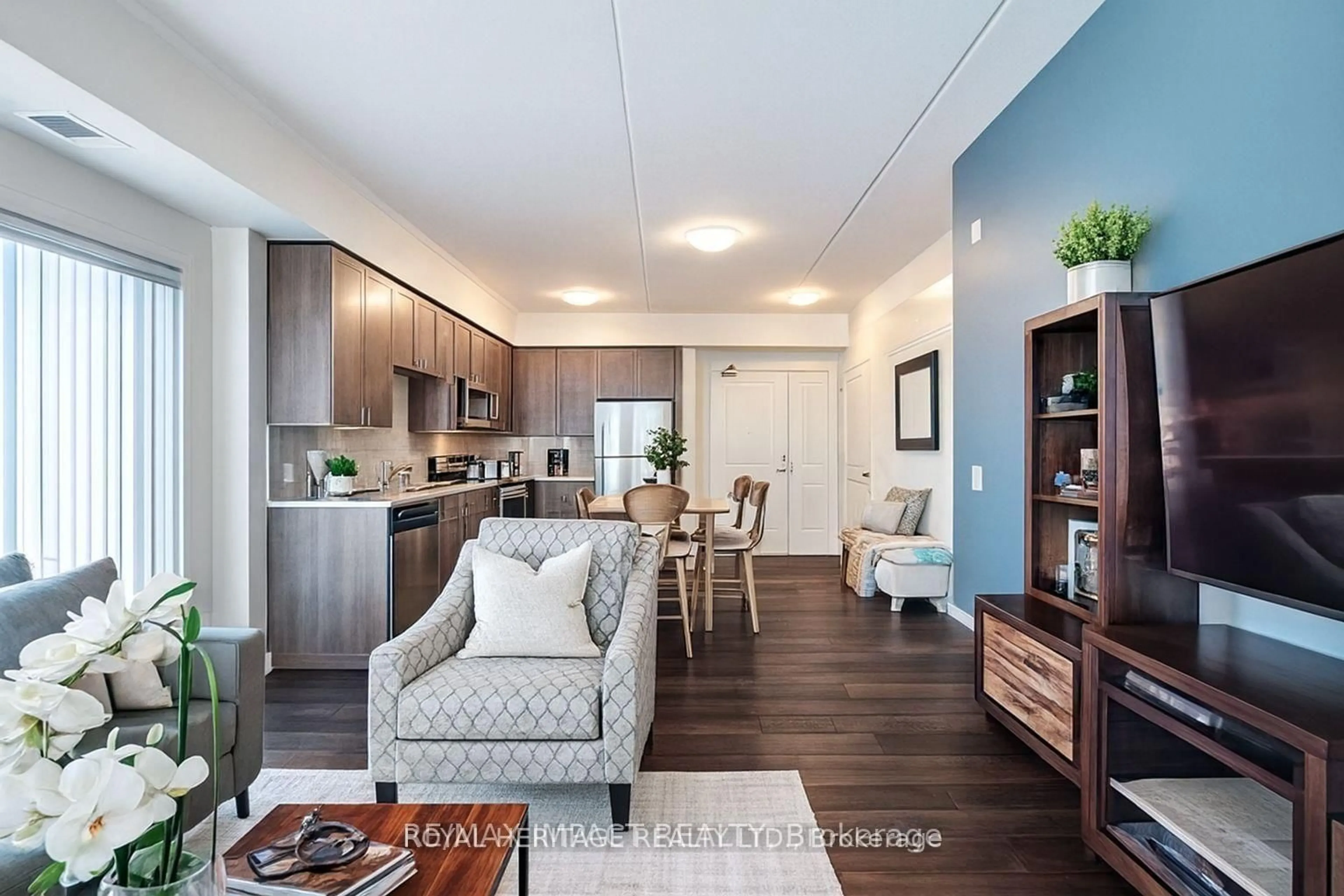 Living room with furniture, wood/laminate floor for 290 Liberty St #209, Clarington Ontario L1C 0V5