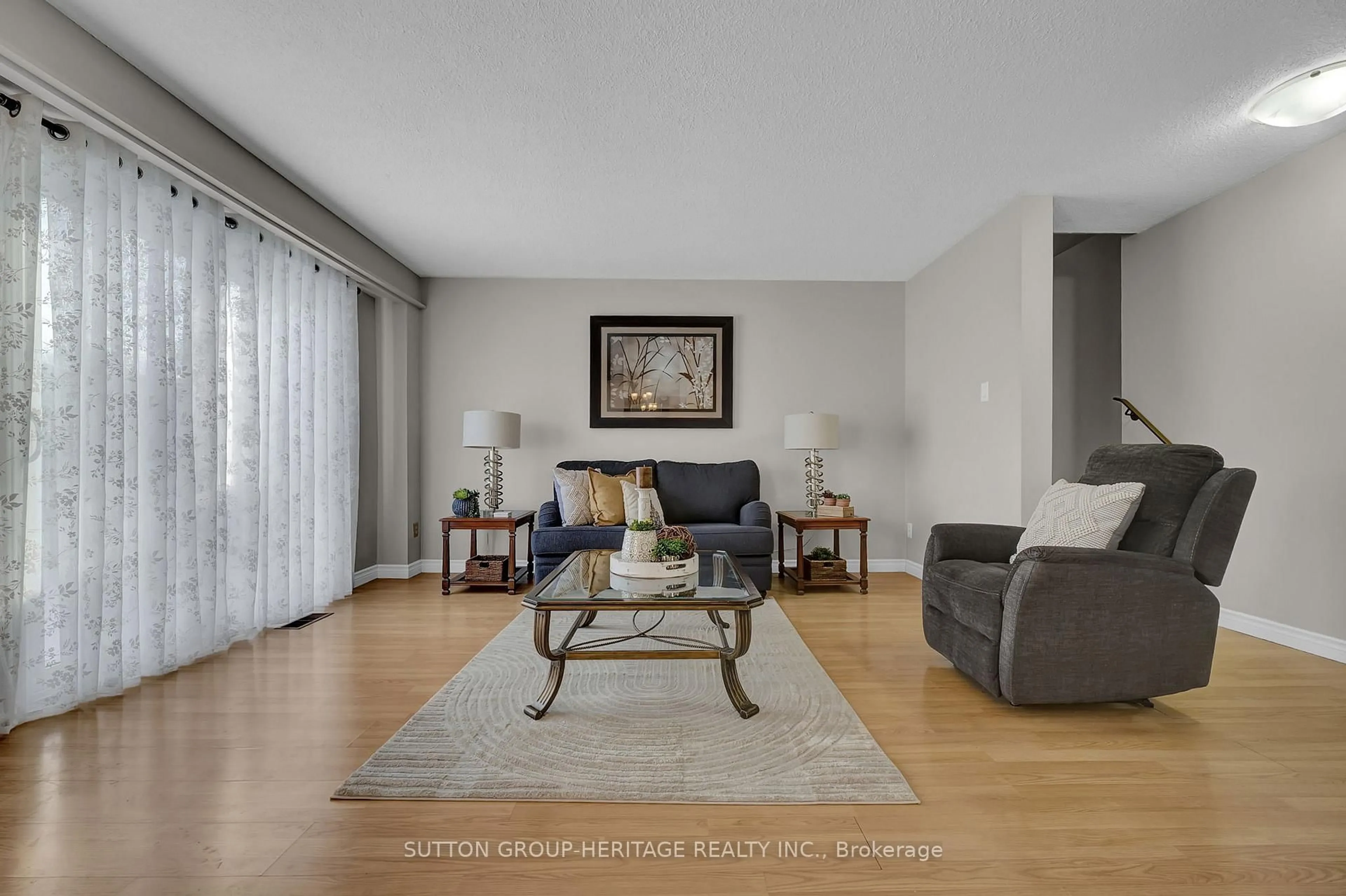 Living room with furniture, wood/laminate floor for 155 Glovers Rd #55, Oshawa Ontario L1G 7A4