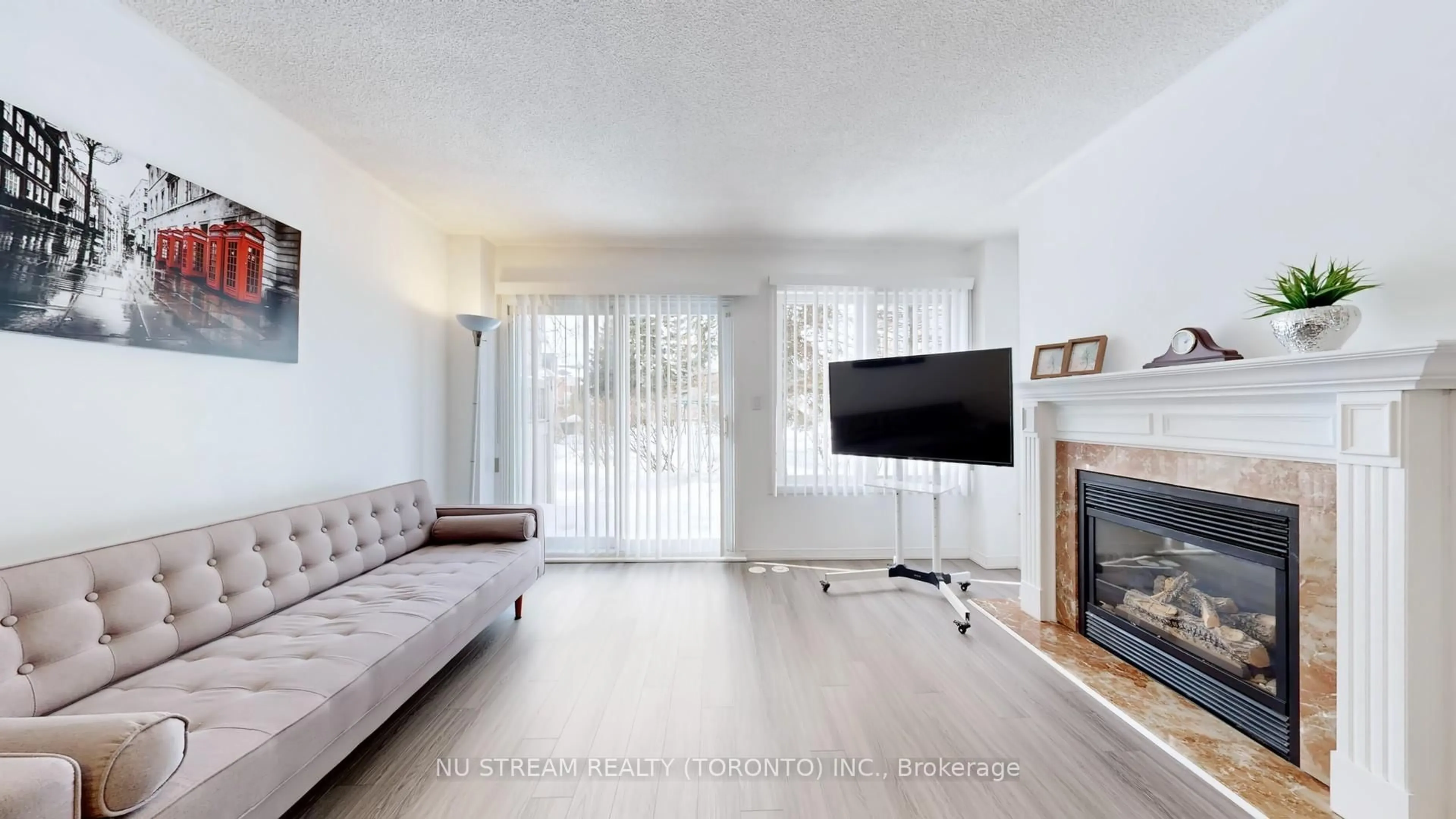 Living room with furniture, wood/laminate floor for 29 Rosebank Dr #907, Toronto Ontario M1B 5Y7