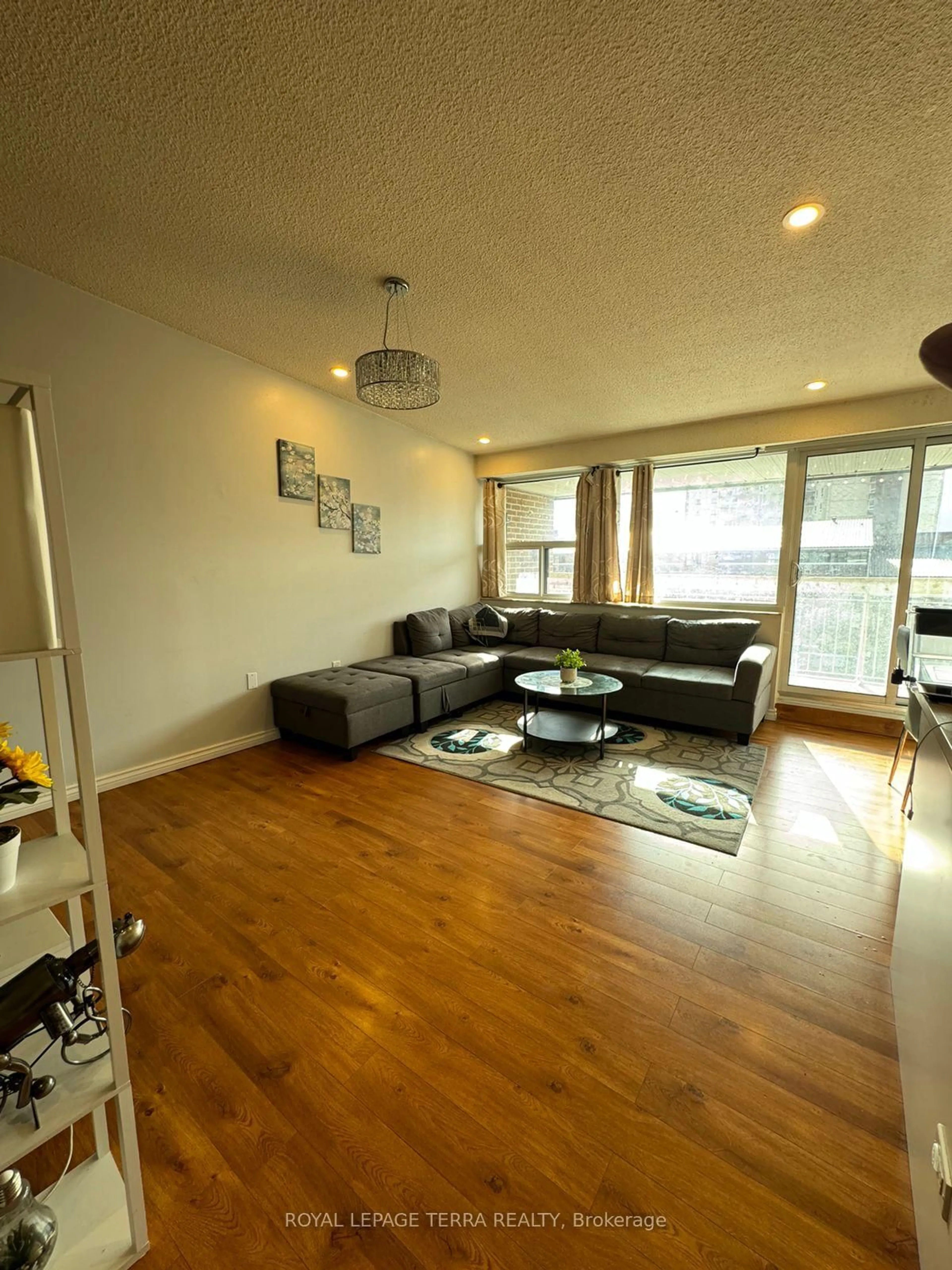 Living room with furniture, wood/laminate floor for 4064 Lawrence Ave #602, Toronto Ontario M1E 4V6