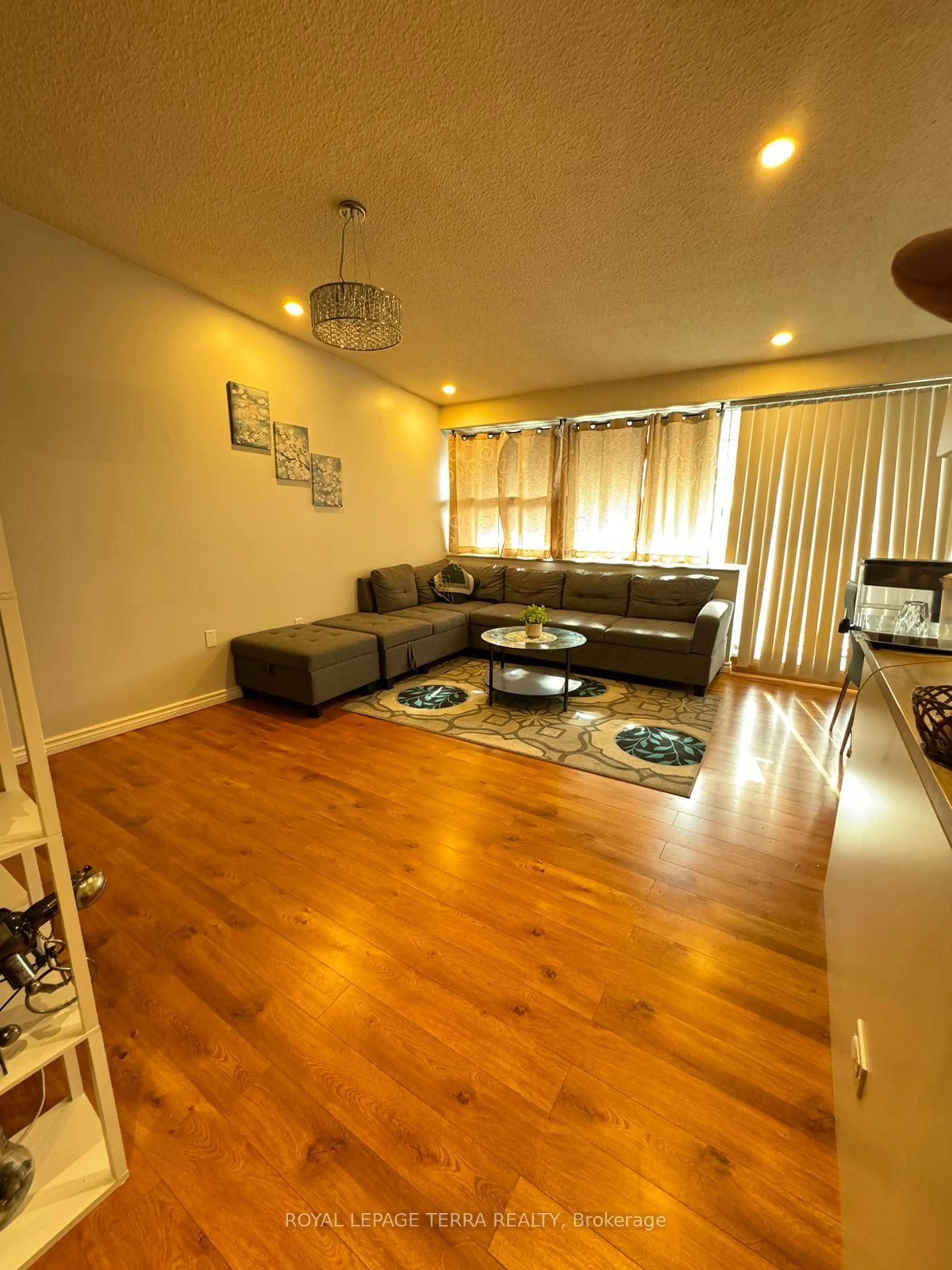Living room with furniture, wood/laminate floor for 4064 Lawrence Ave #602, Toronto Ontario M1E 4V6