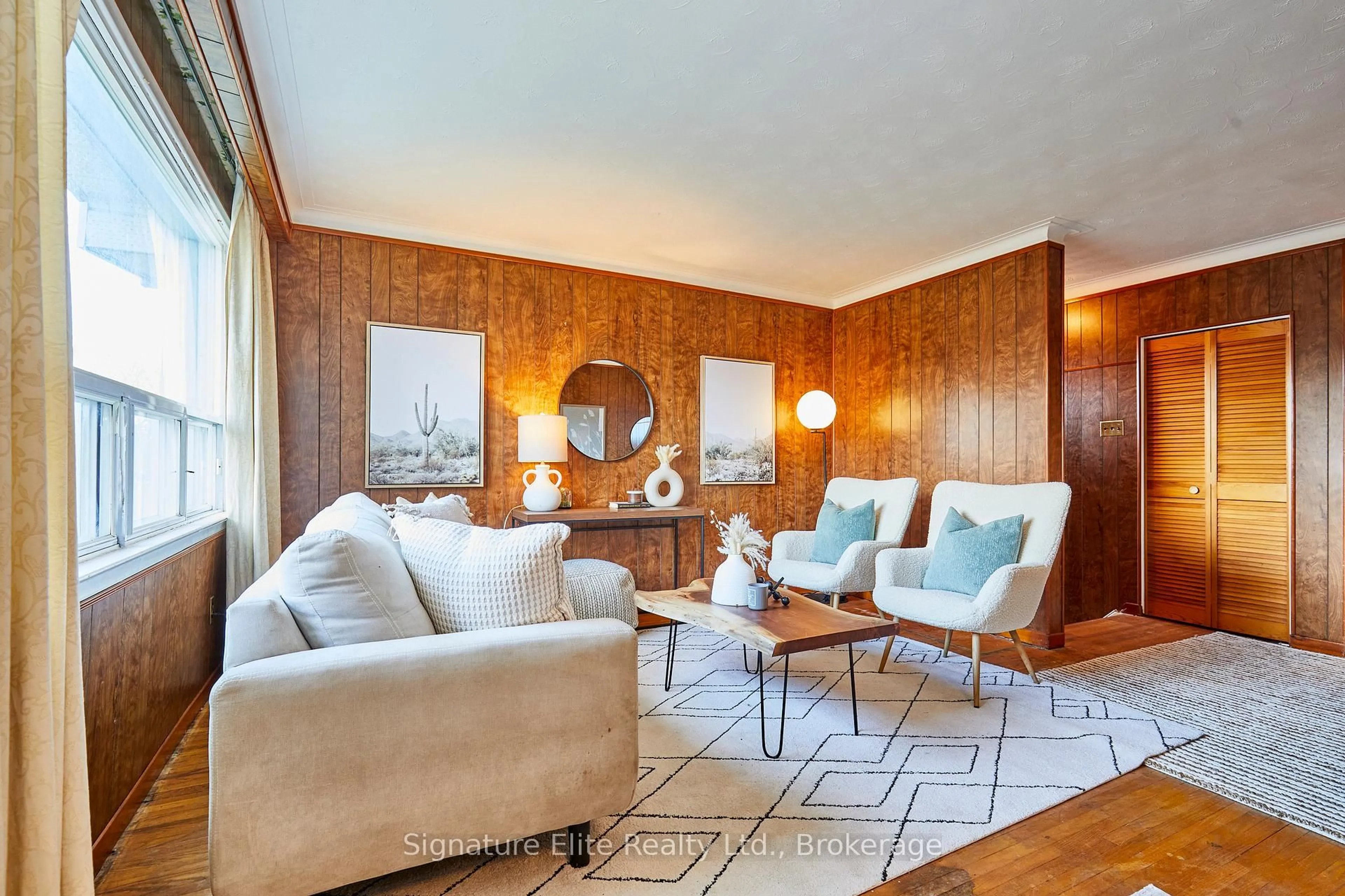 Living room with furniture, wood/laminate floor for 49 Savarin St, Toronto Ontario M1J 1Z9