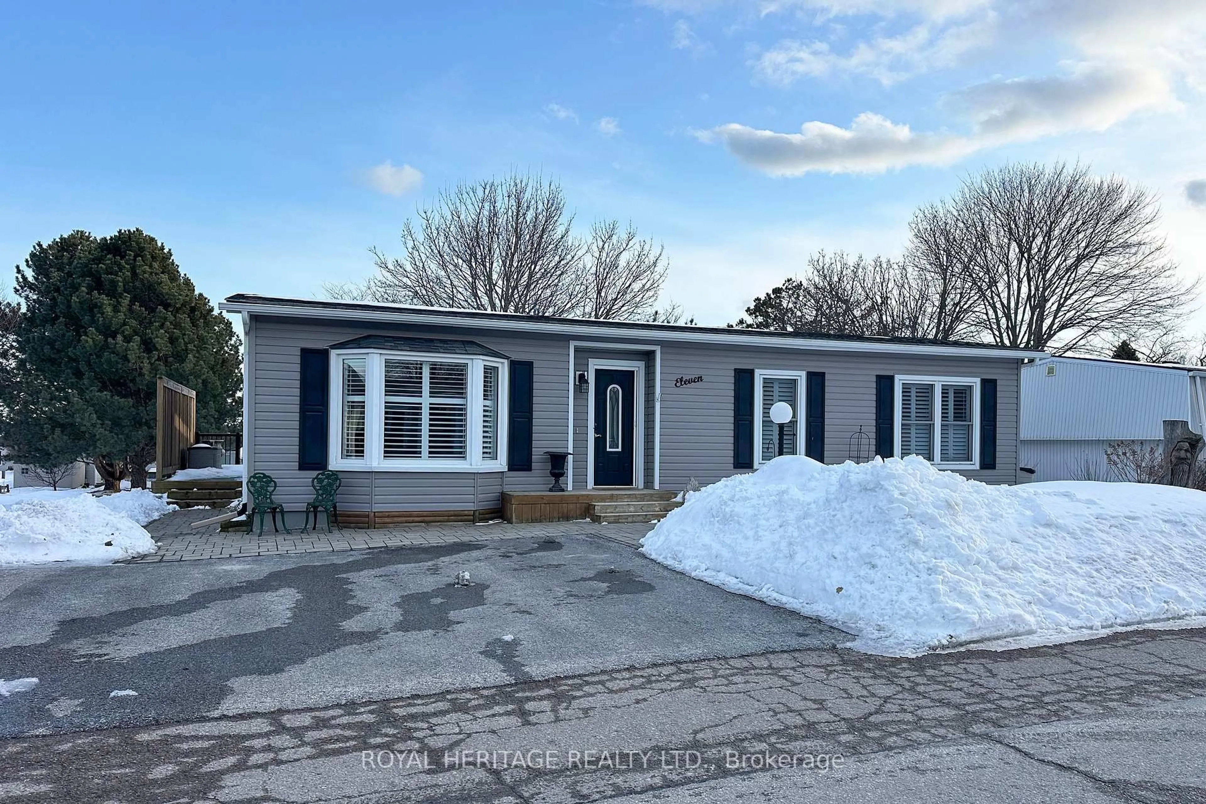 Home with vinyl exterior material, street for 11 Heritage Lane, Clarington Ontario L1B 1A5