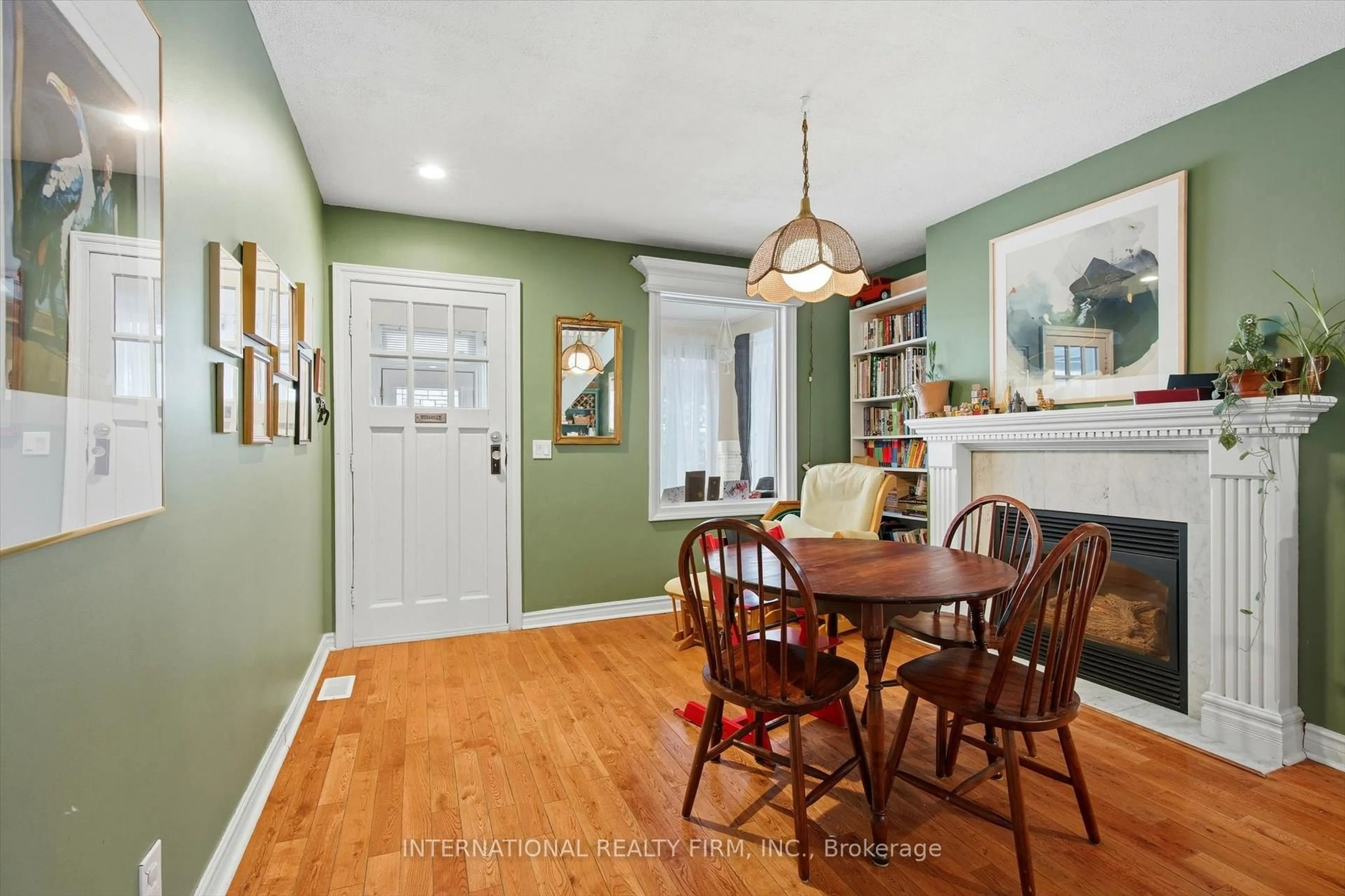 Dining room, wood/laminate floor for 116 Merrill Ave, Toronto Ontario M4C 1C9
