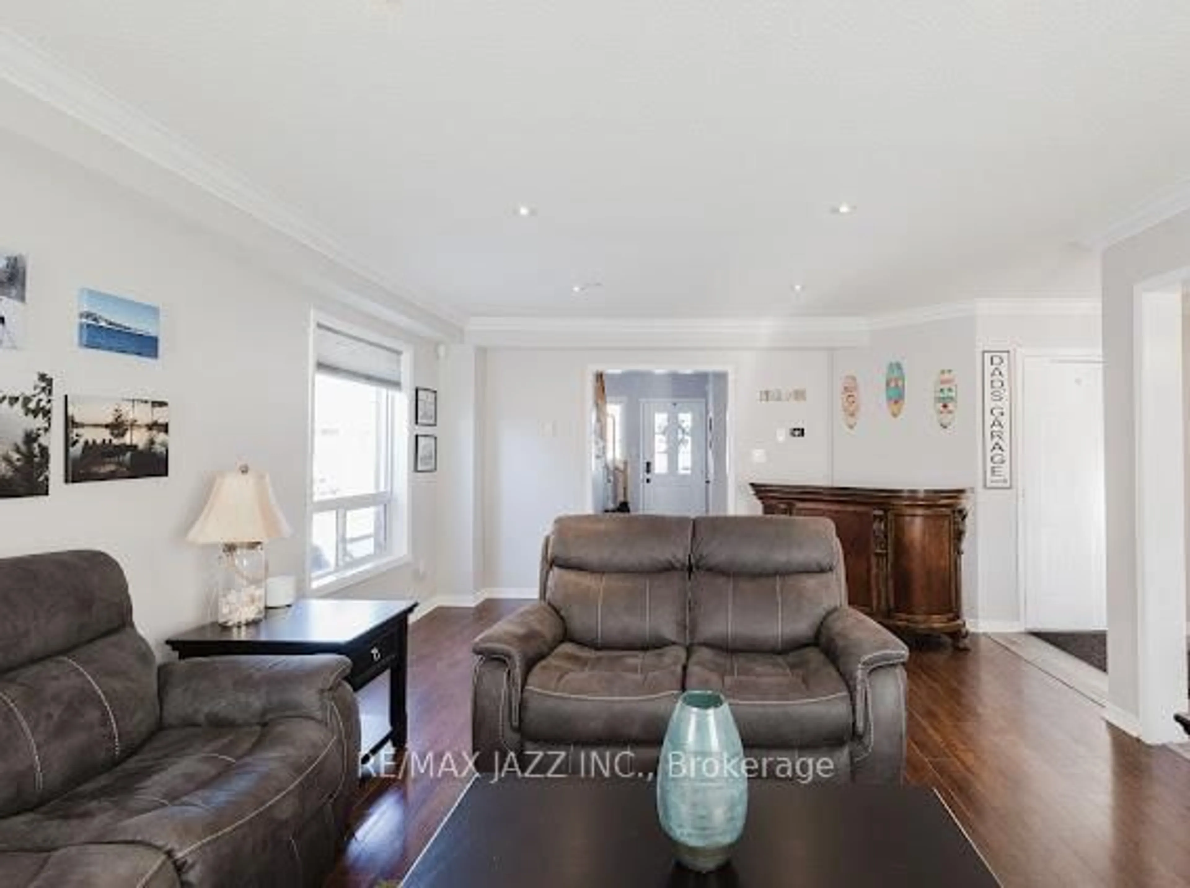 Living room with furniture, wood/laminate floor for 104 Calwell Dr, Scugog Ontario L9L 1T7