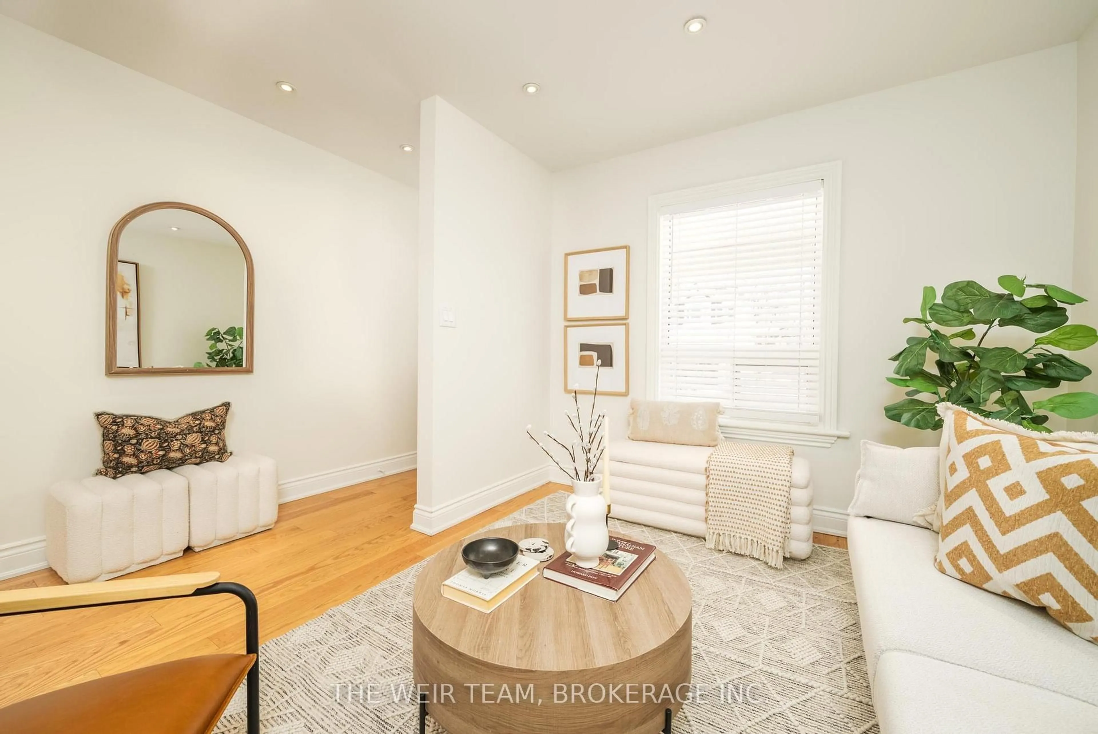 Living room with furniture, wood/laminate floor for 10 Eldon Ave, Toronto Ontario M4C 5G1