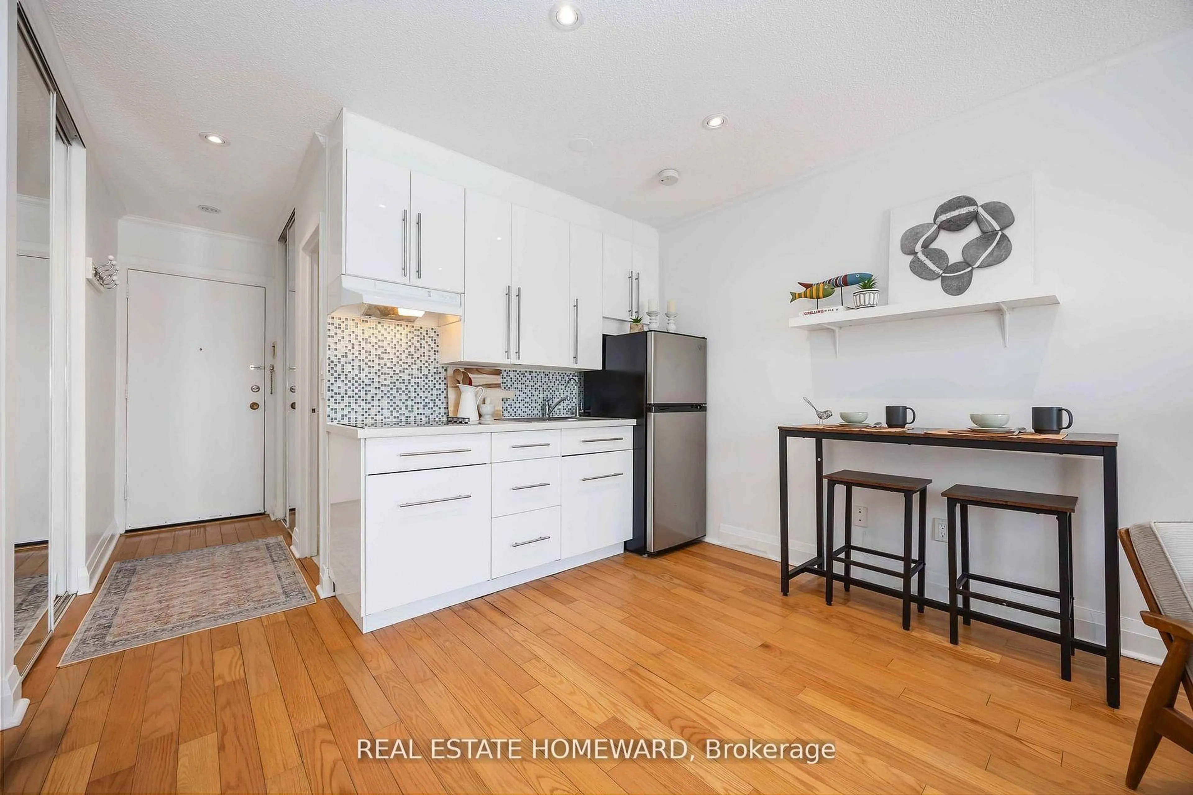 Open concept kitchen, wood/laminate floor for 123 Woodbine Ave #207, Toronto Ontario M4L 3V8