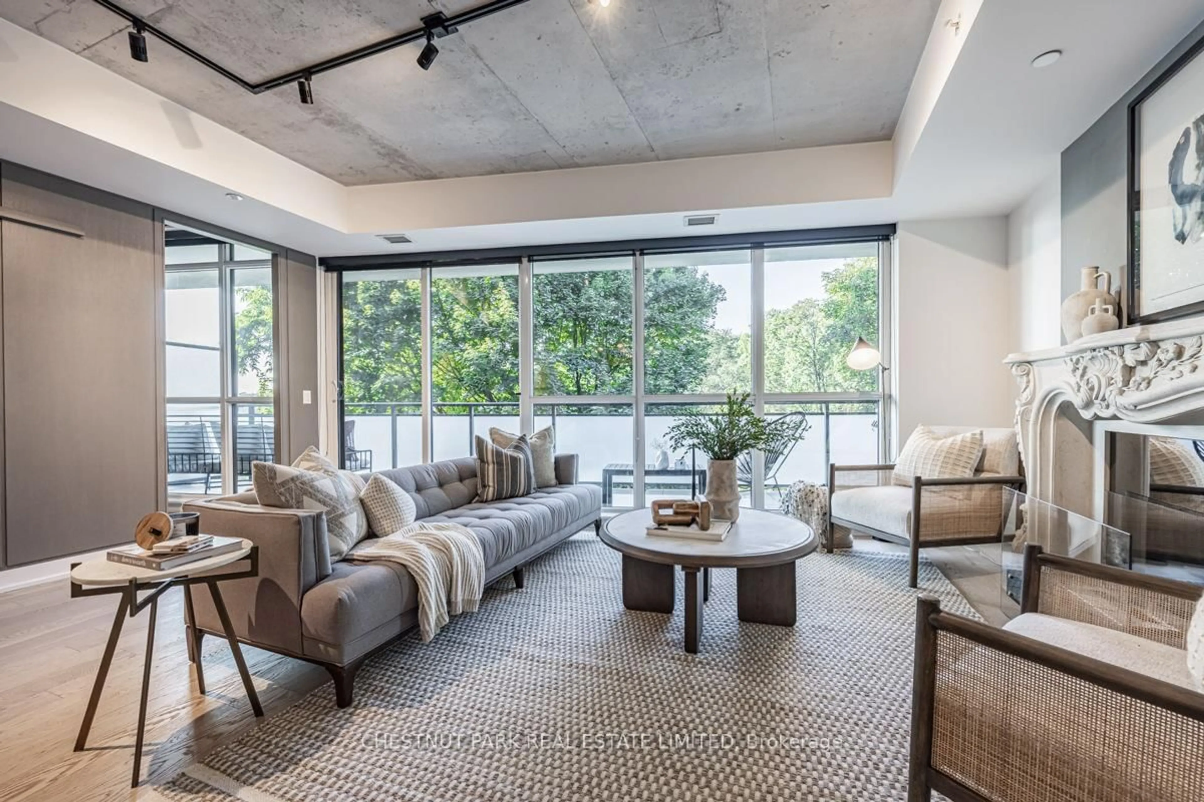 Living room with furniture, cement floor for 630 Kingston Rd #201, Toronto Ontario M4E 0B7