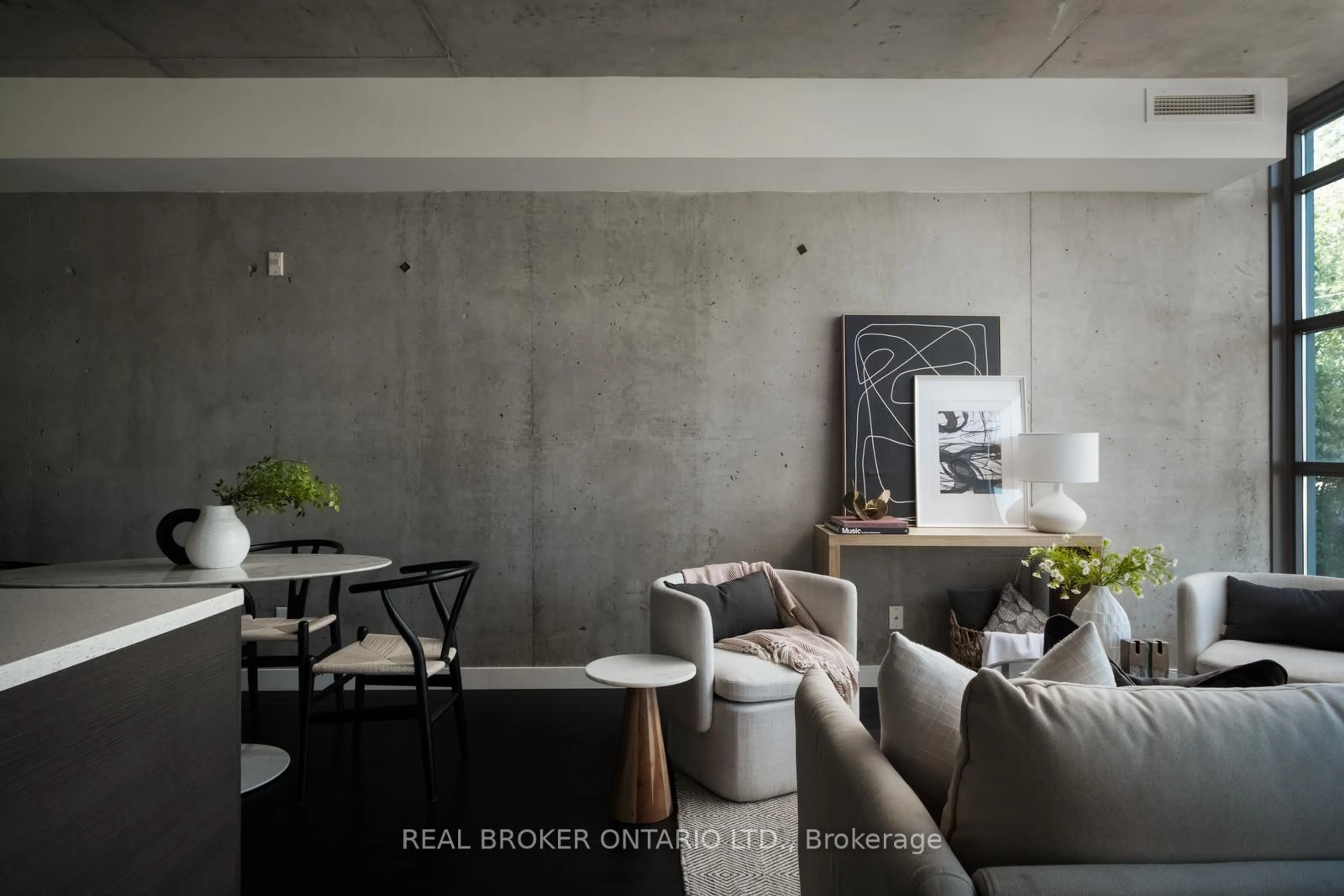 Living room with furniture, cement floor for 90 Broadview Ave #202, Toronto Ontario M4M 0A7