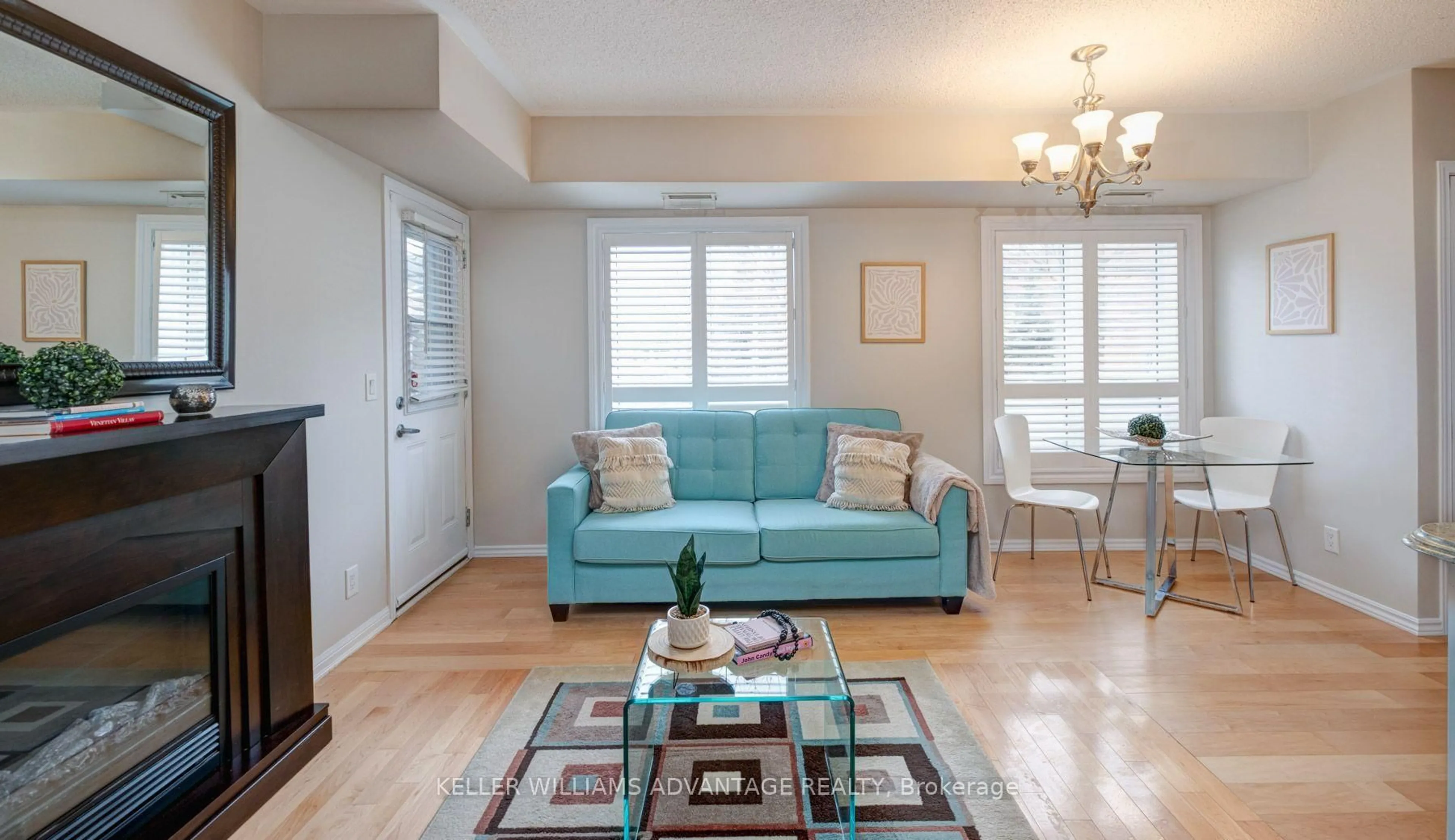 Living room with furniture, wood/laminate floor for 60 Mendelssohn St #107, Toronto Ontario M1L 0G9