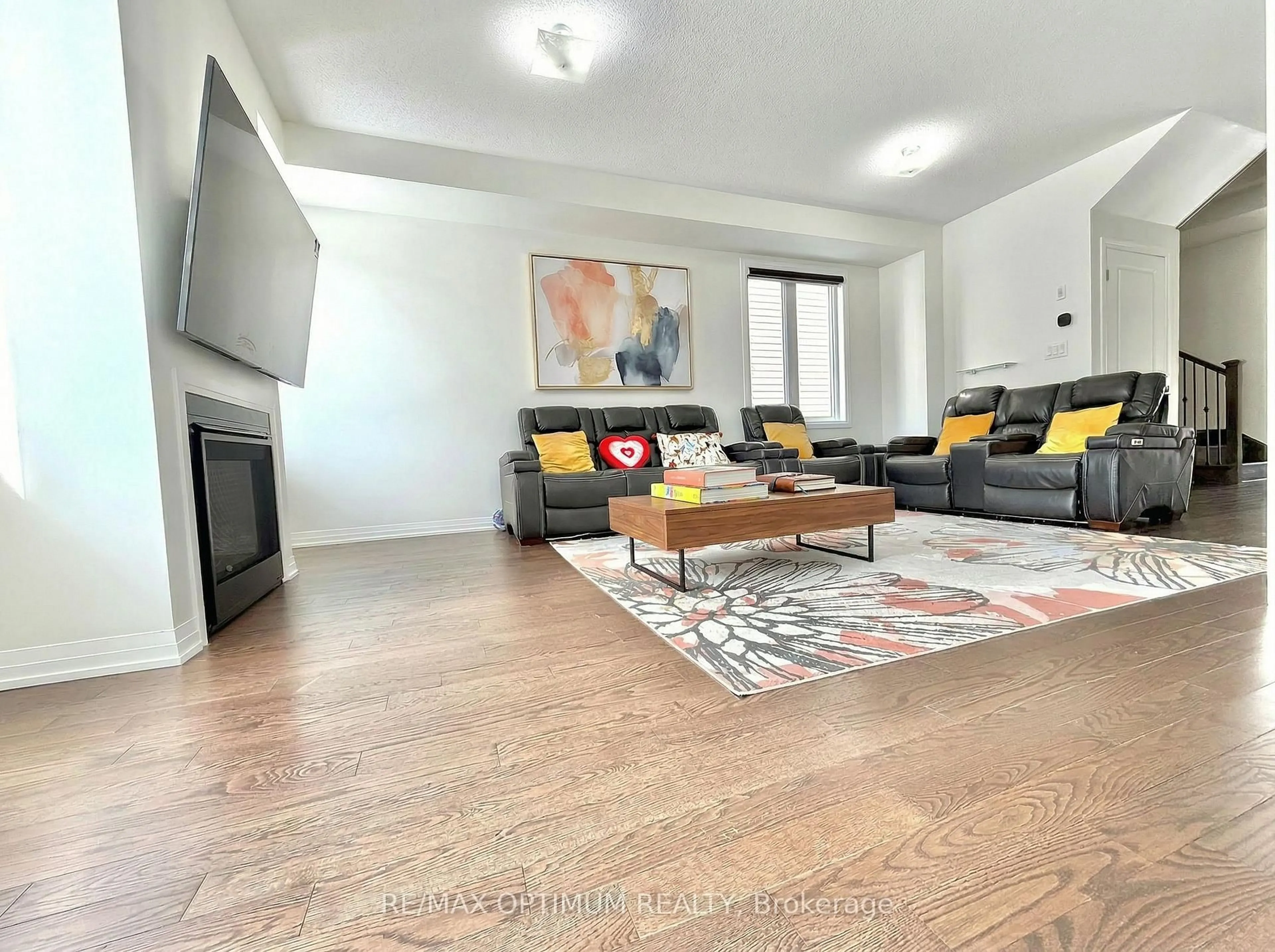 Living room with furniture, wood/laminate floor for 42 Cryderman Lane, Clarington Ontario L1C 1Z8