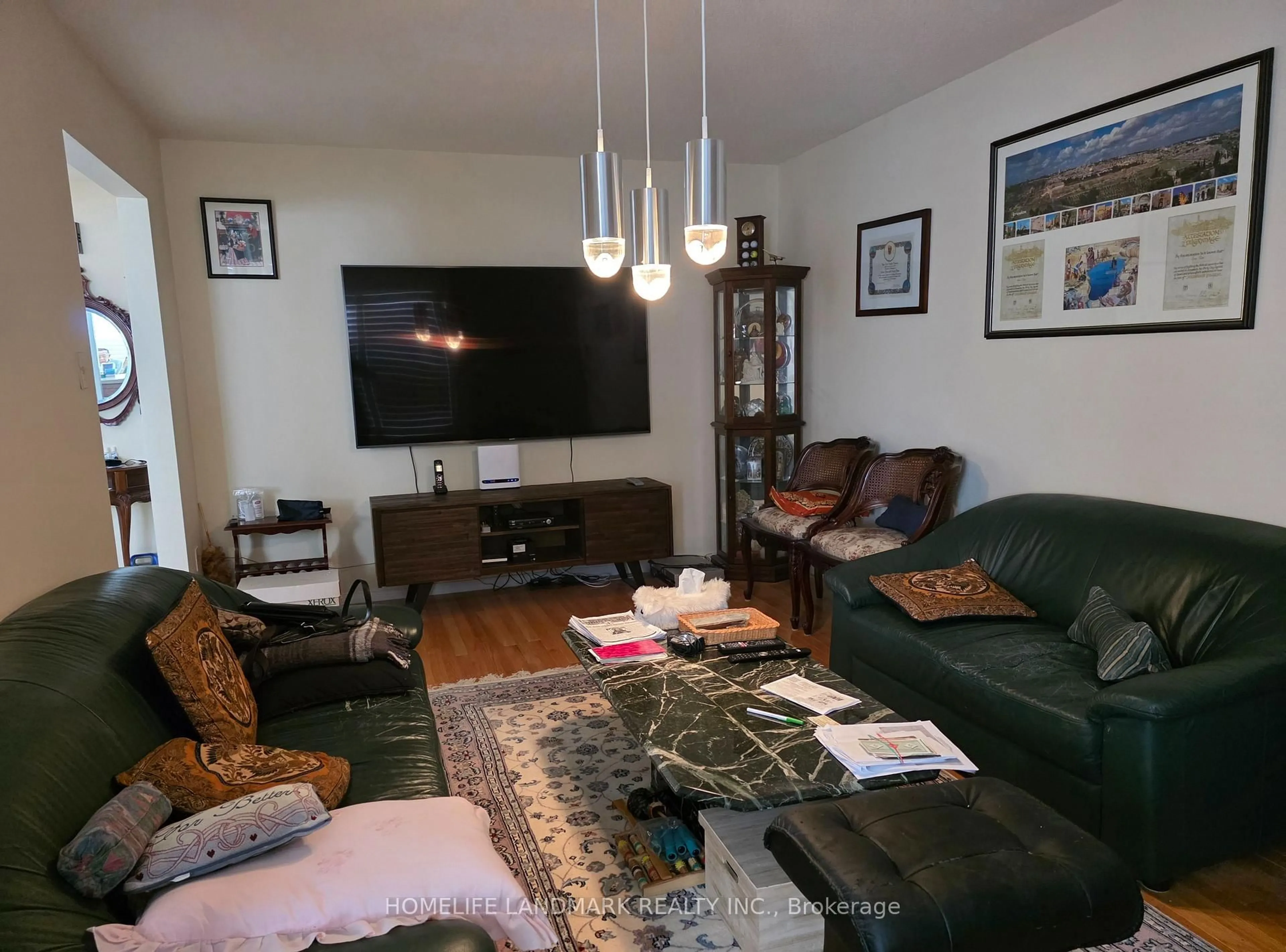 Living room with furniture, wood/laminate floor for 144 Canongate Tr, Toronto Ontario M1V 3G9