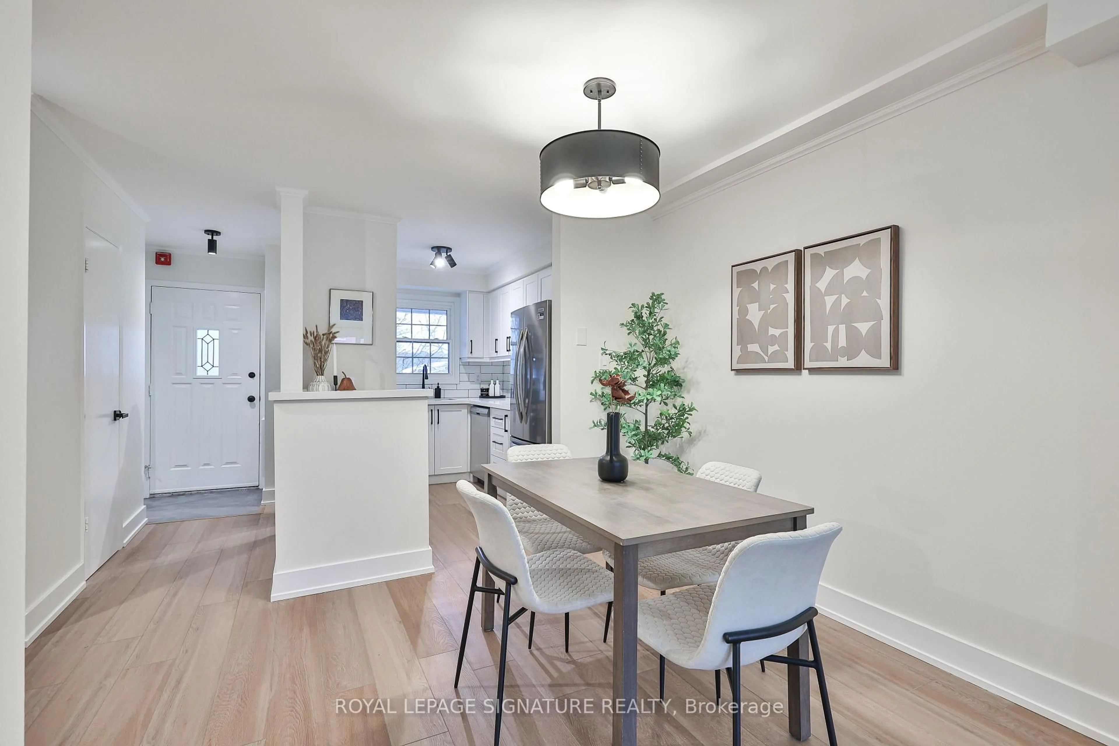 Dining room, wood/laminate floor for 101 Glen Manor Dr #6, Toronto Ontario M4E 3V3