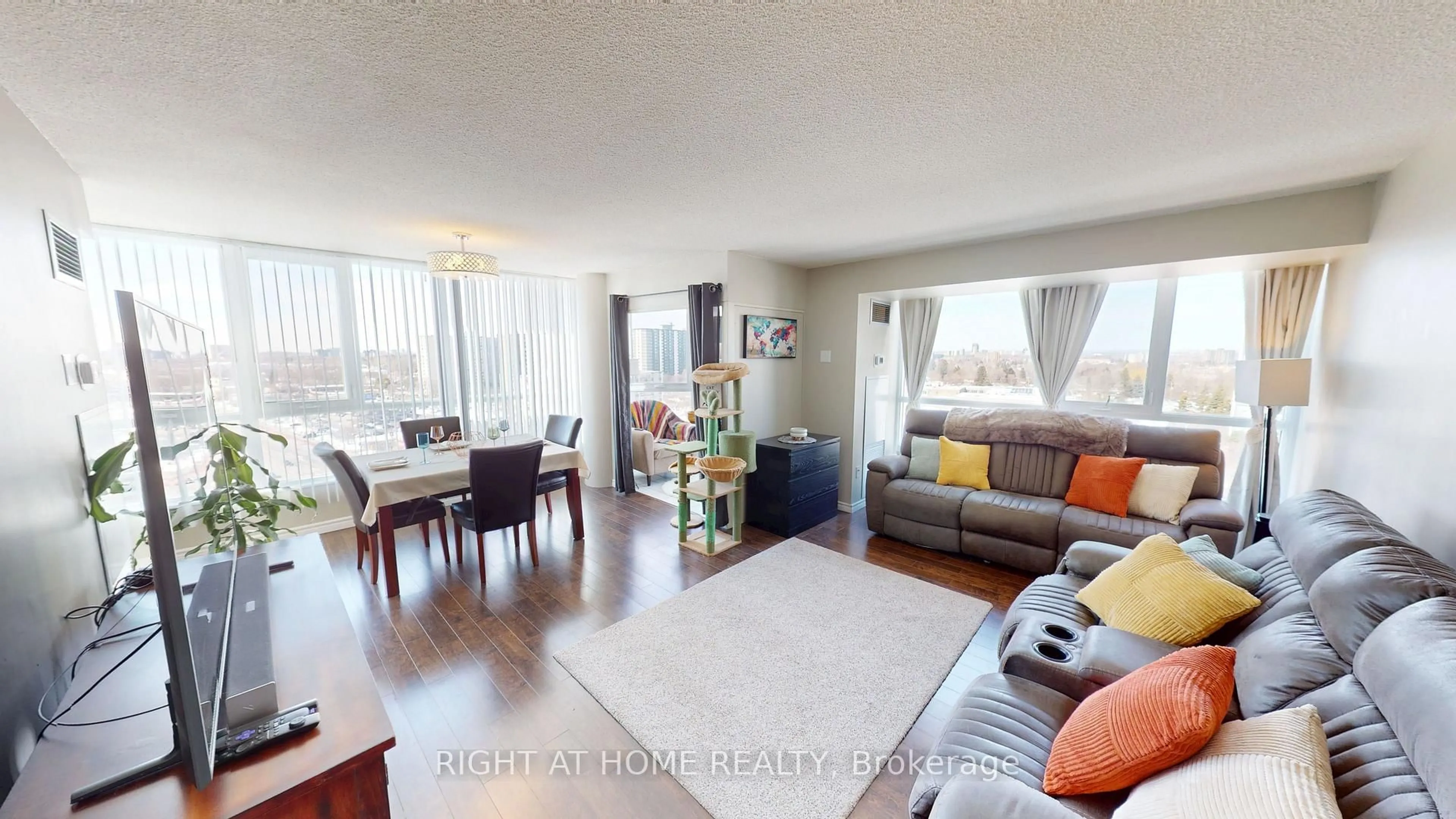 Living room with furniture, wood/laminate floor for 3231 Eglinton Ave #1206, Toronto Ontario M1J 3N5