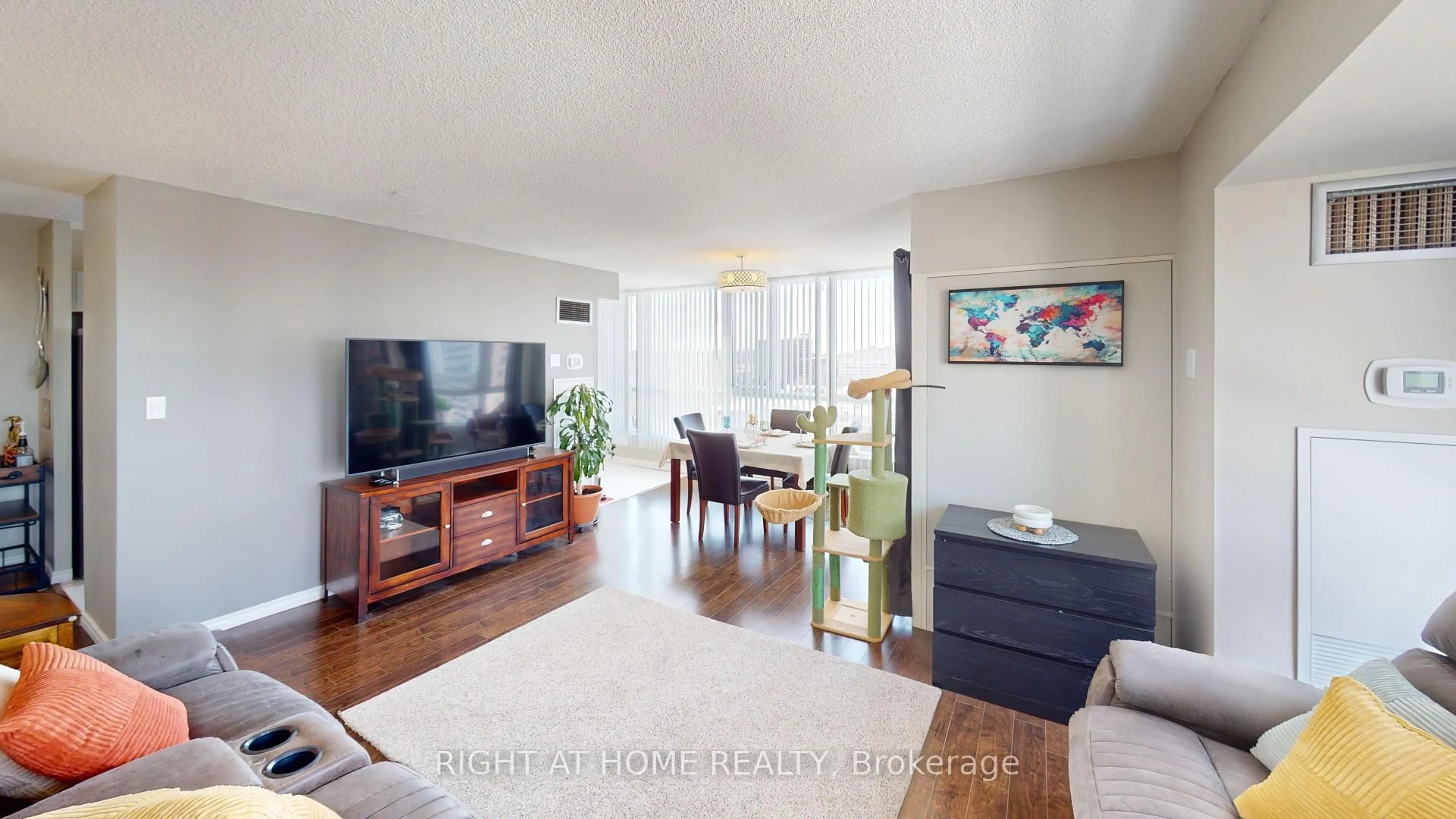 Living room with furniture, wood/laminate floor for 3231 Eglinton Ave #1206, Toronto Ontario M1J 3N5